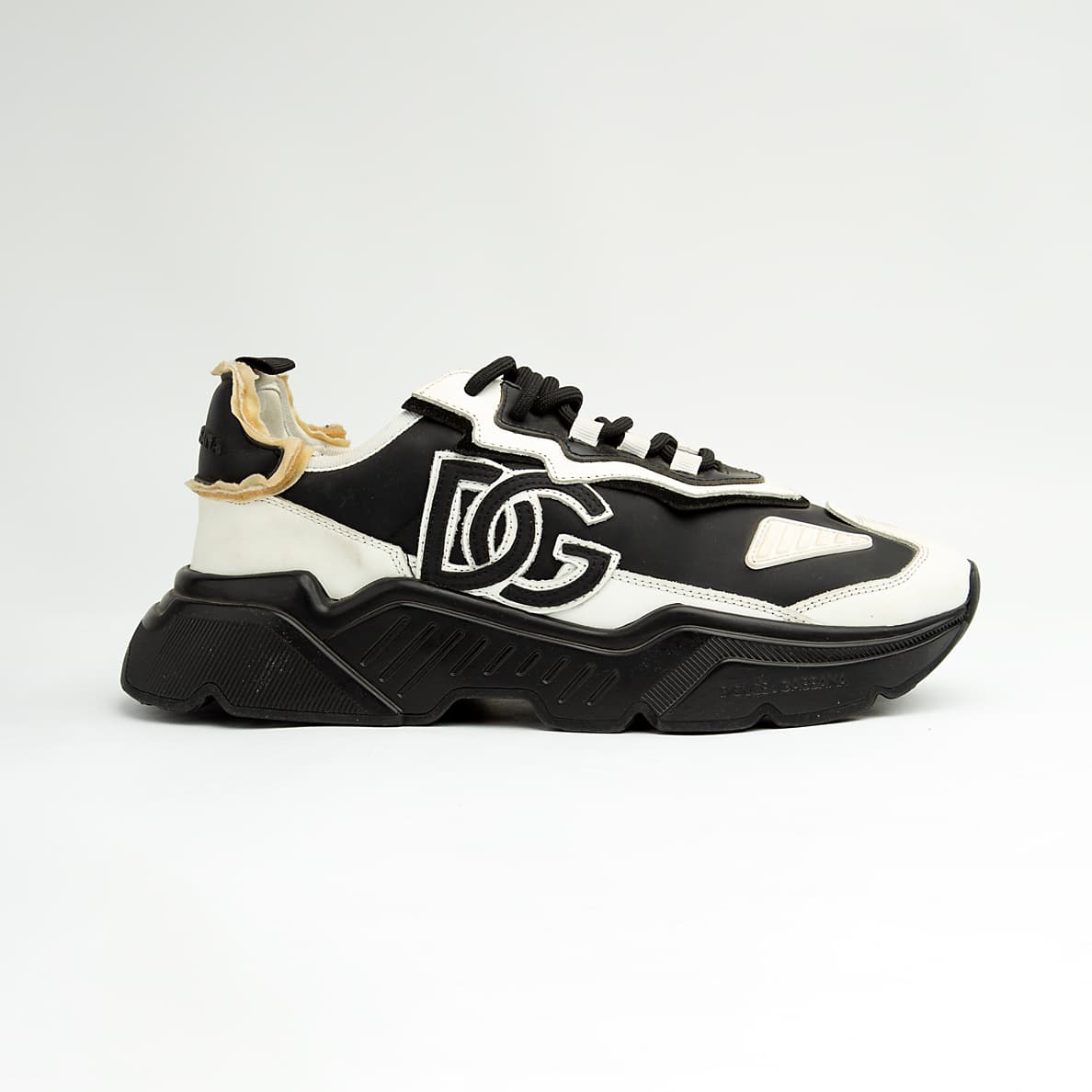 Monochrome chunky black and white unisex sneakers with bold DG-style design and thick sole.