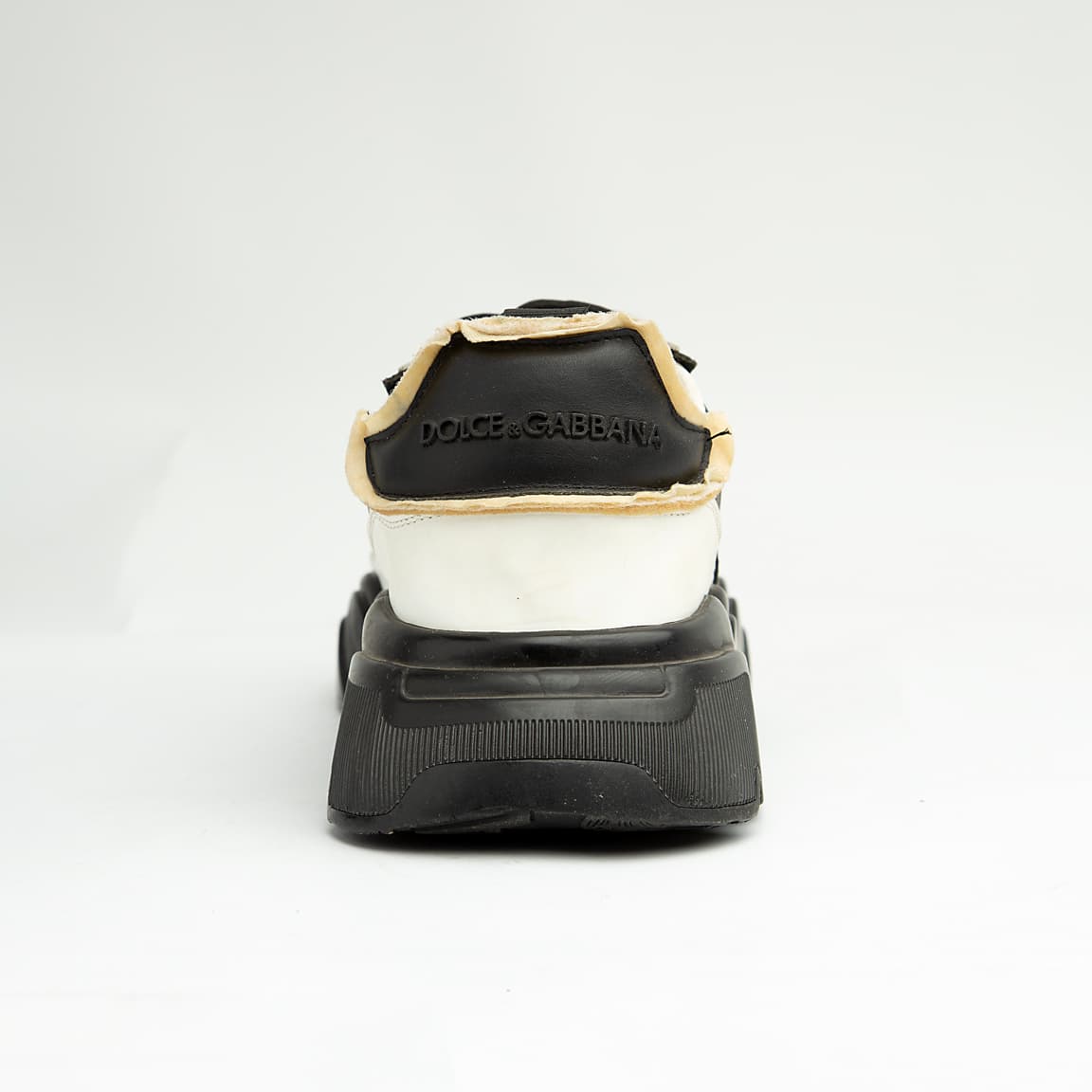 Monochrome chunky black and white unisex sneakers with bold DG-style design and thick sole.