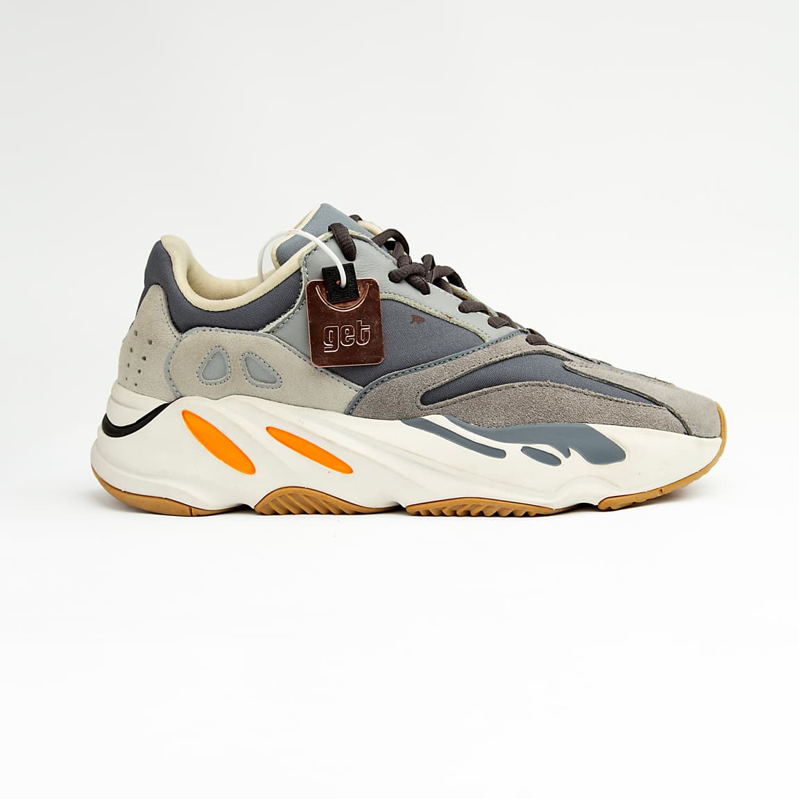 Grey and orange unisex chunky retro sneakers with suede, mesh, and leather detailing.
