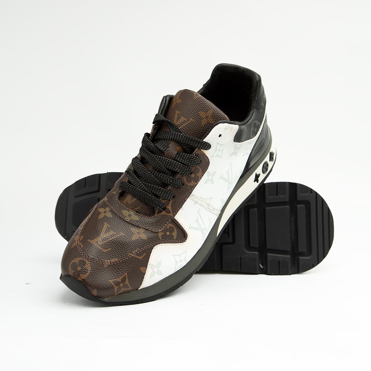 Louis Vuitton brown and white dual-tone unisex sneakers with monogram pattern and black sole, premium designer footwear.