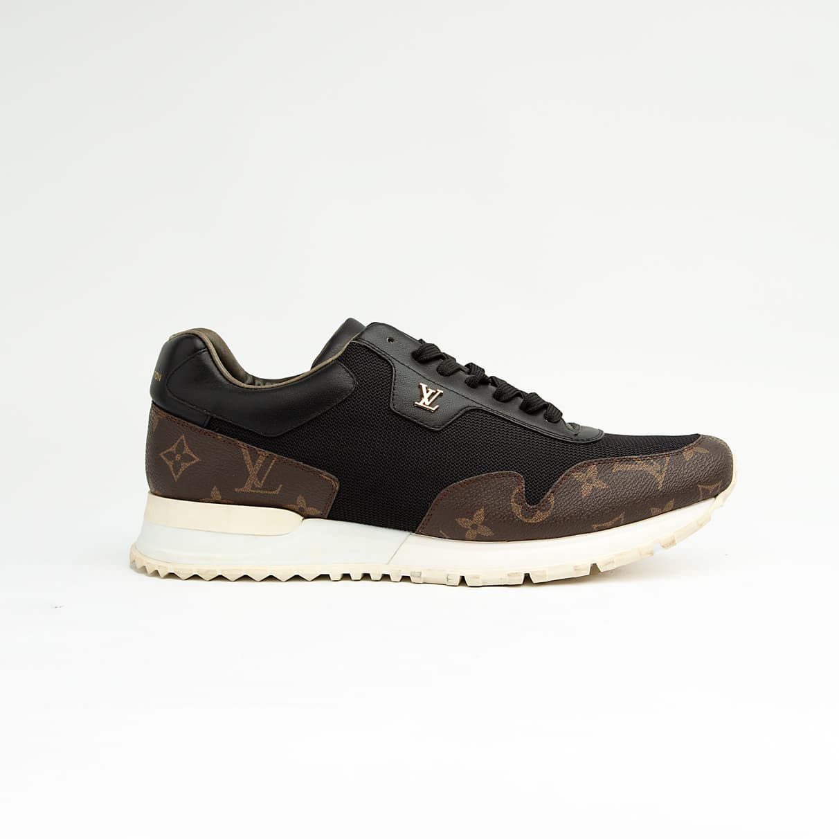 Luxury black and brown Louis Vuitton monogram unisex sneakers with white sole and gold LV logo.