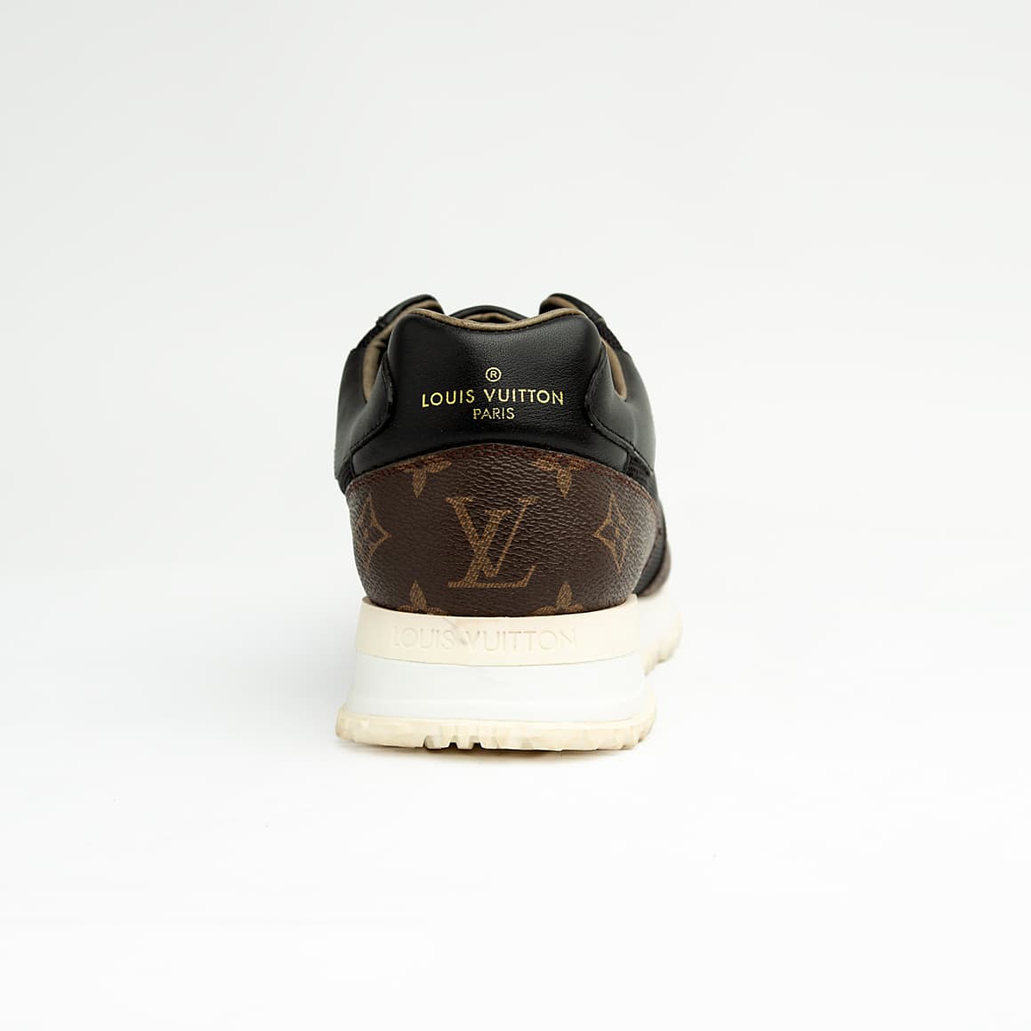 Luxury black and brown Louis Vuitton monogram unisex sneakers with white sole and gold LV logo.
