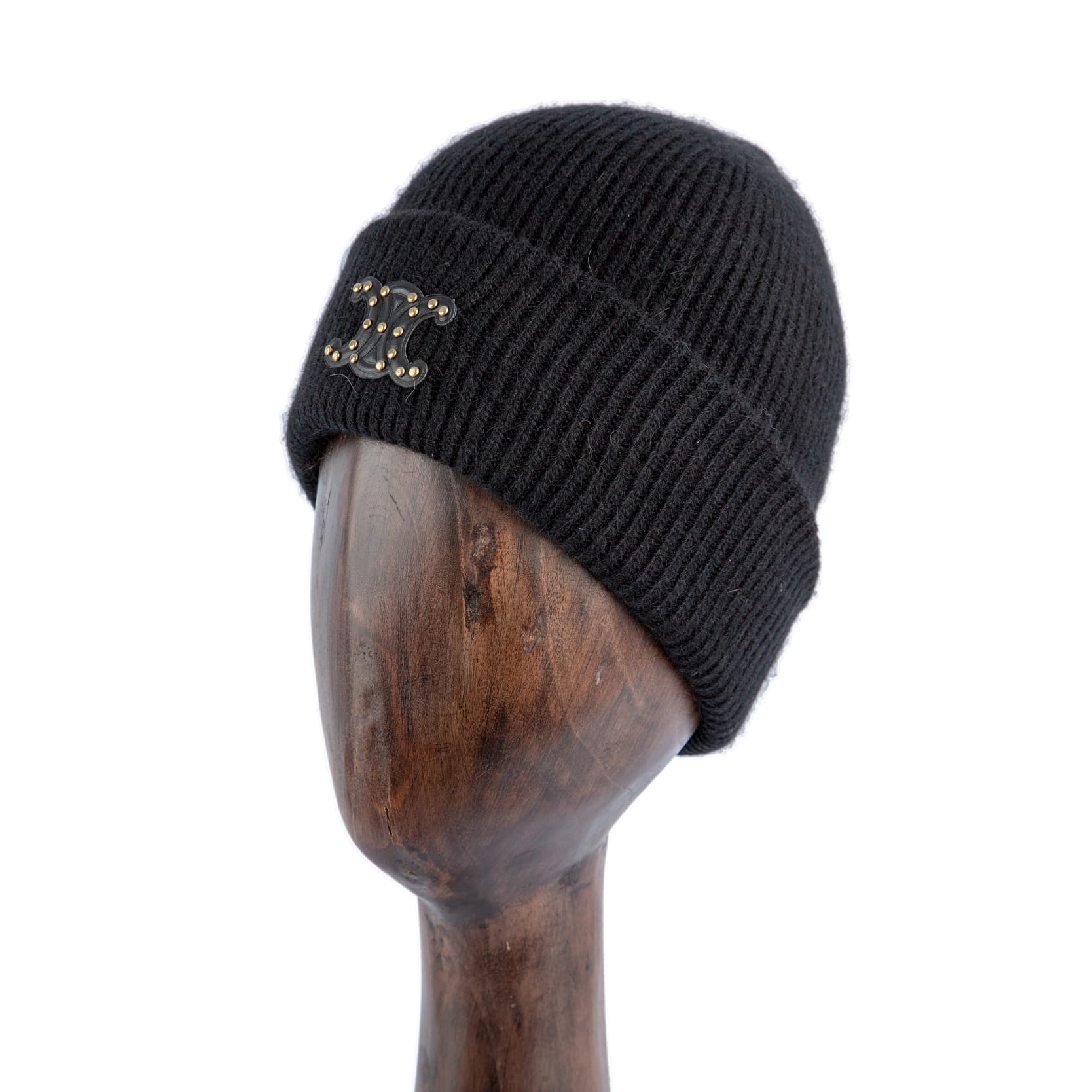 Black luxury knitted beanie with gold-studded logo emblem for men and women, soft and warm winter accessory available on Agu.ng.