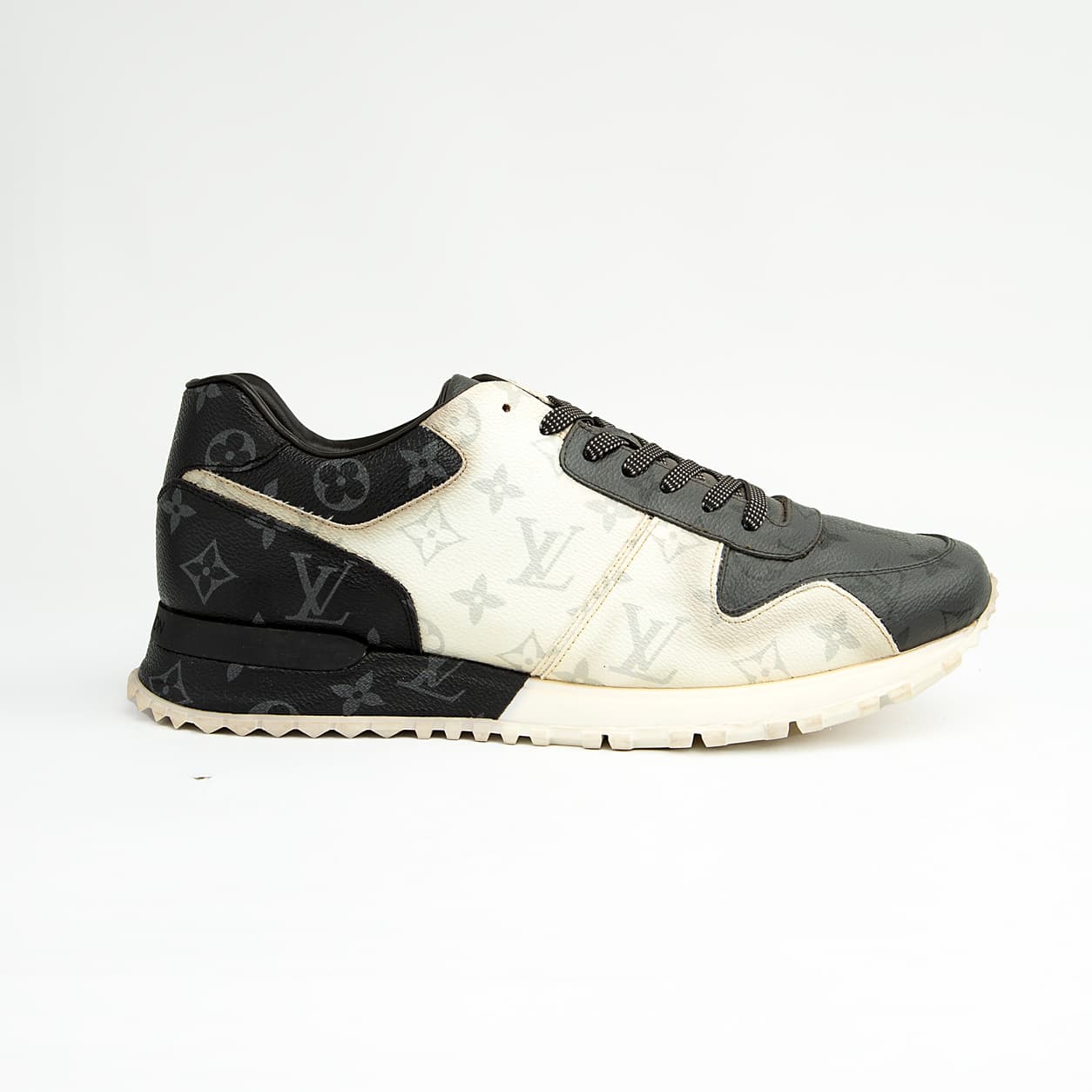Louis Vuitton black and white unisex sneakers with monogram eclipse design and white sole.