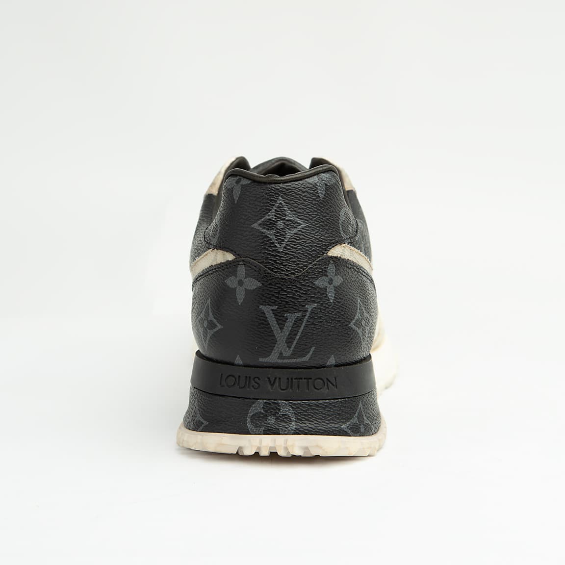 Louis Vuitton black and white unisex sneakers with monogram eclipse design and white sole.