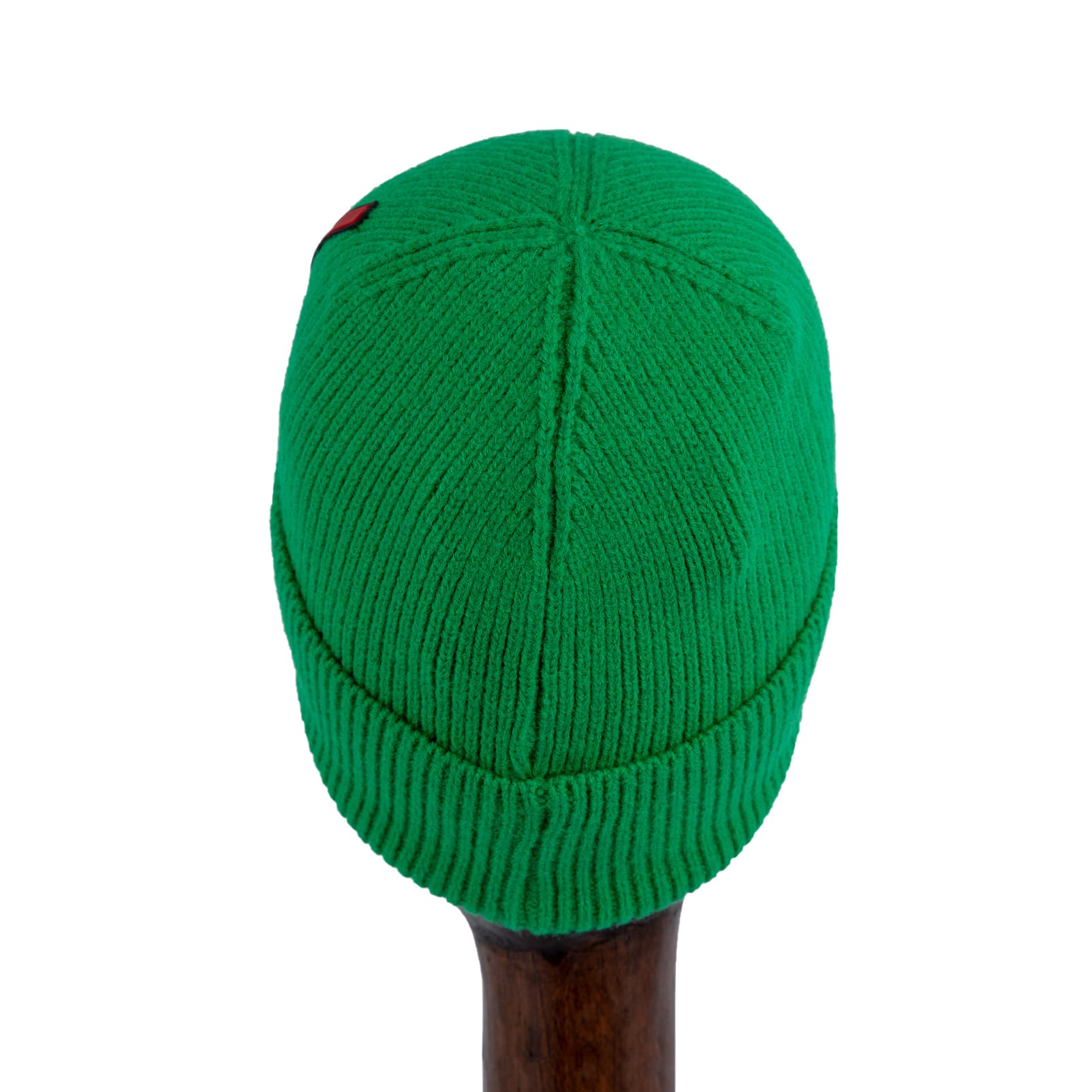 Ribbed Knit Wool Beanie Head warmer in bright green with red logo tag, perfect for stylish winter warmth.