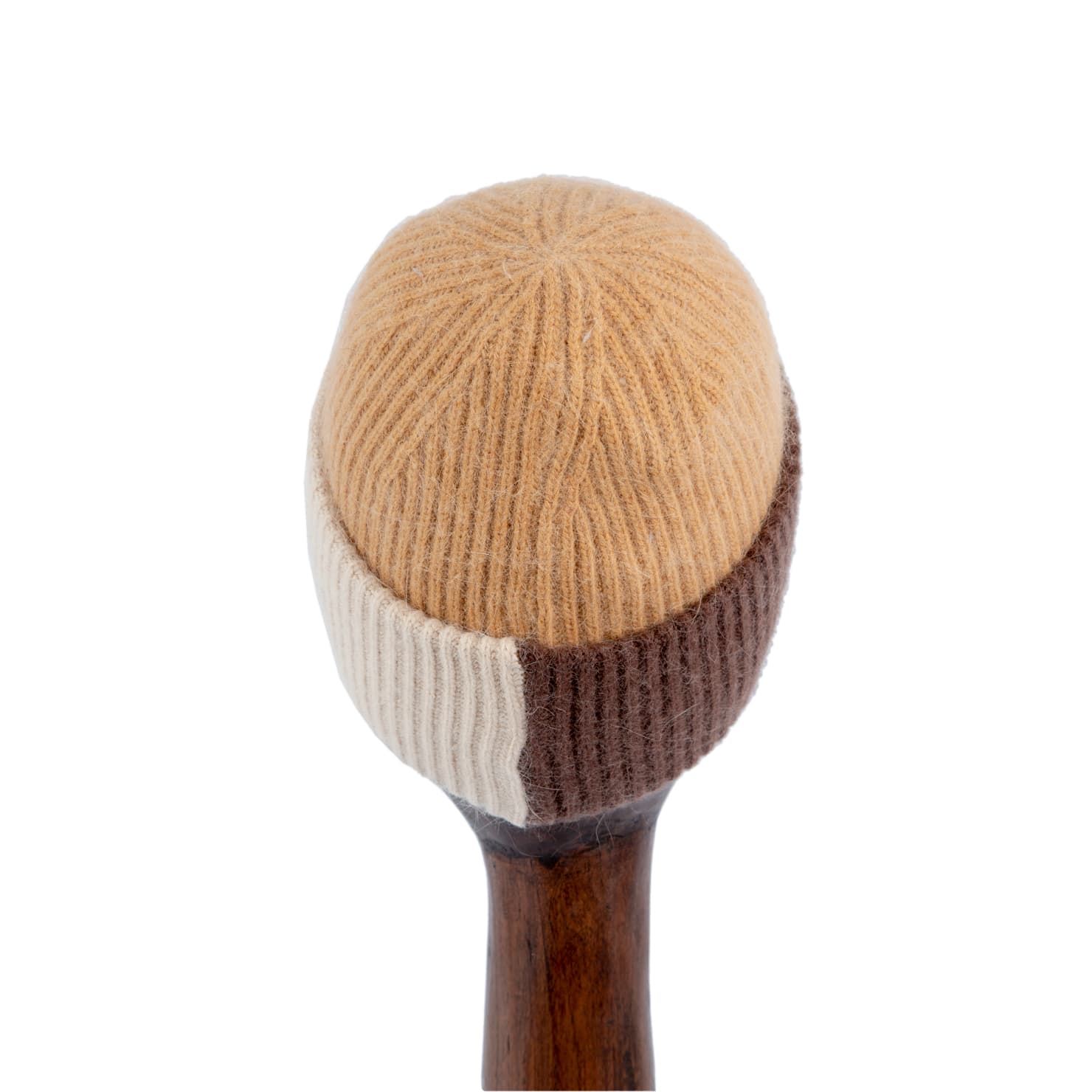 Multi-tone wool beanie in brown, beige, and camel with white logo.