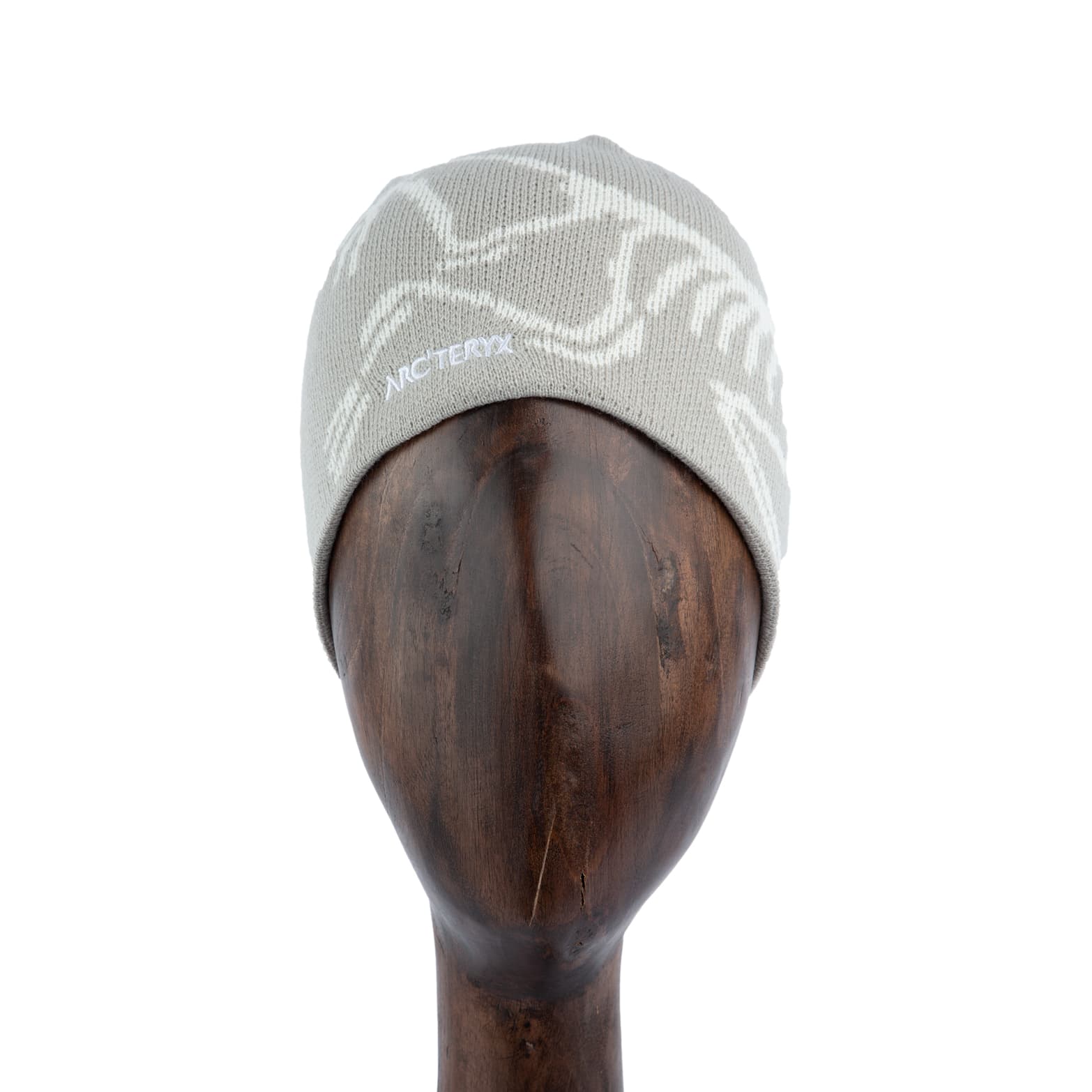 Grey knit beanie with white logo design, premium winter hat.