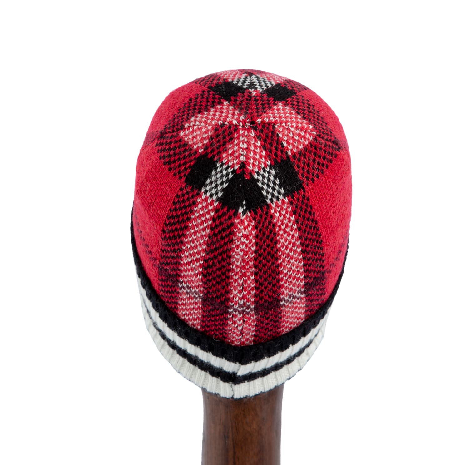Red plaid wool knit beanie with black and white striped pattern, perfect for warmth and style during cold weather.