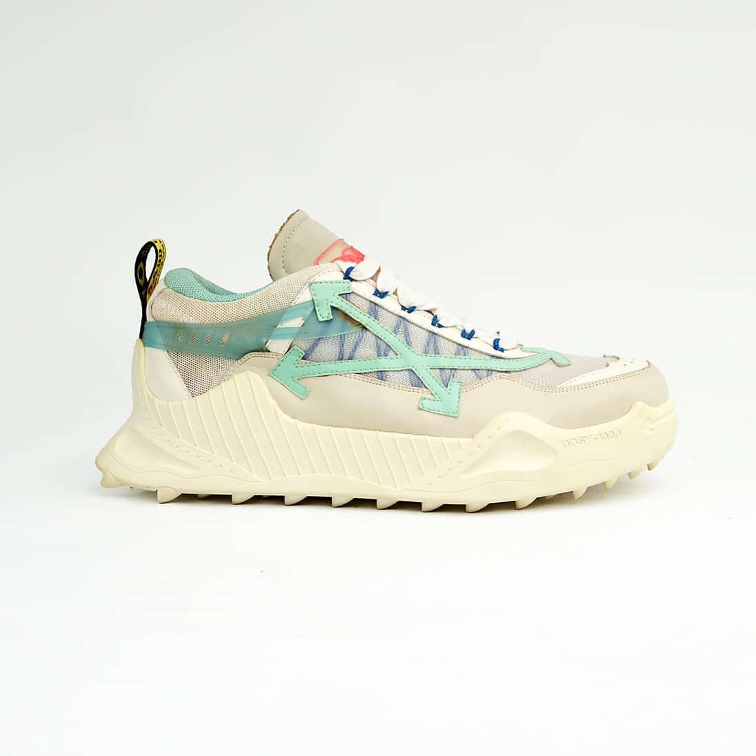 Chunky cream and mint green unisex mesh sneakers with rugged soles and gradient side detail for a sporty modern look.