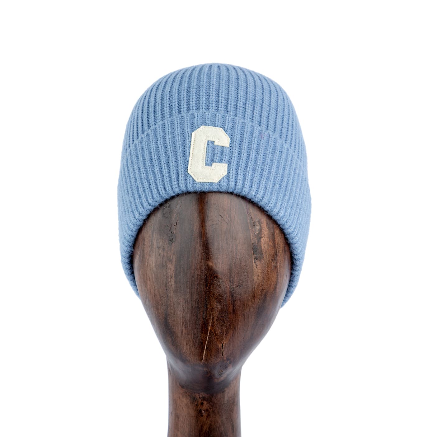 Light blue ribbed knit beanie with embroidered 'C' patch, stylish unisex winter hat.