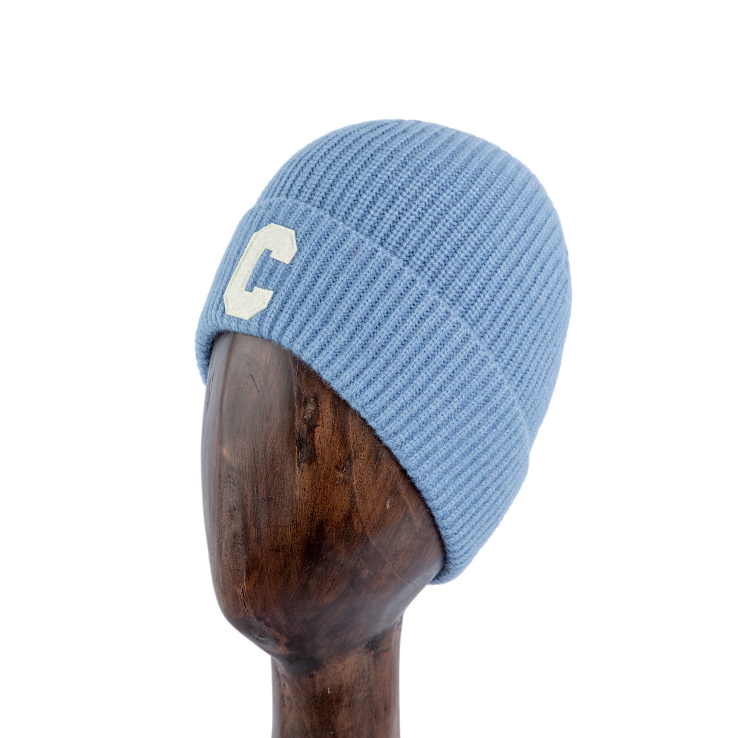 Light blue ribbed knit beanie with embroidered 'C' patch, stylish unisex winter hat.