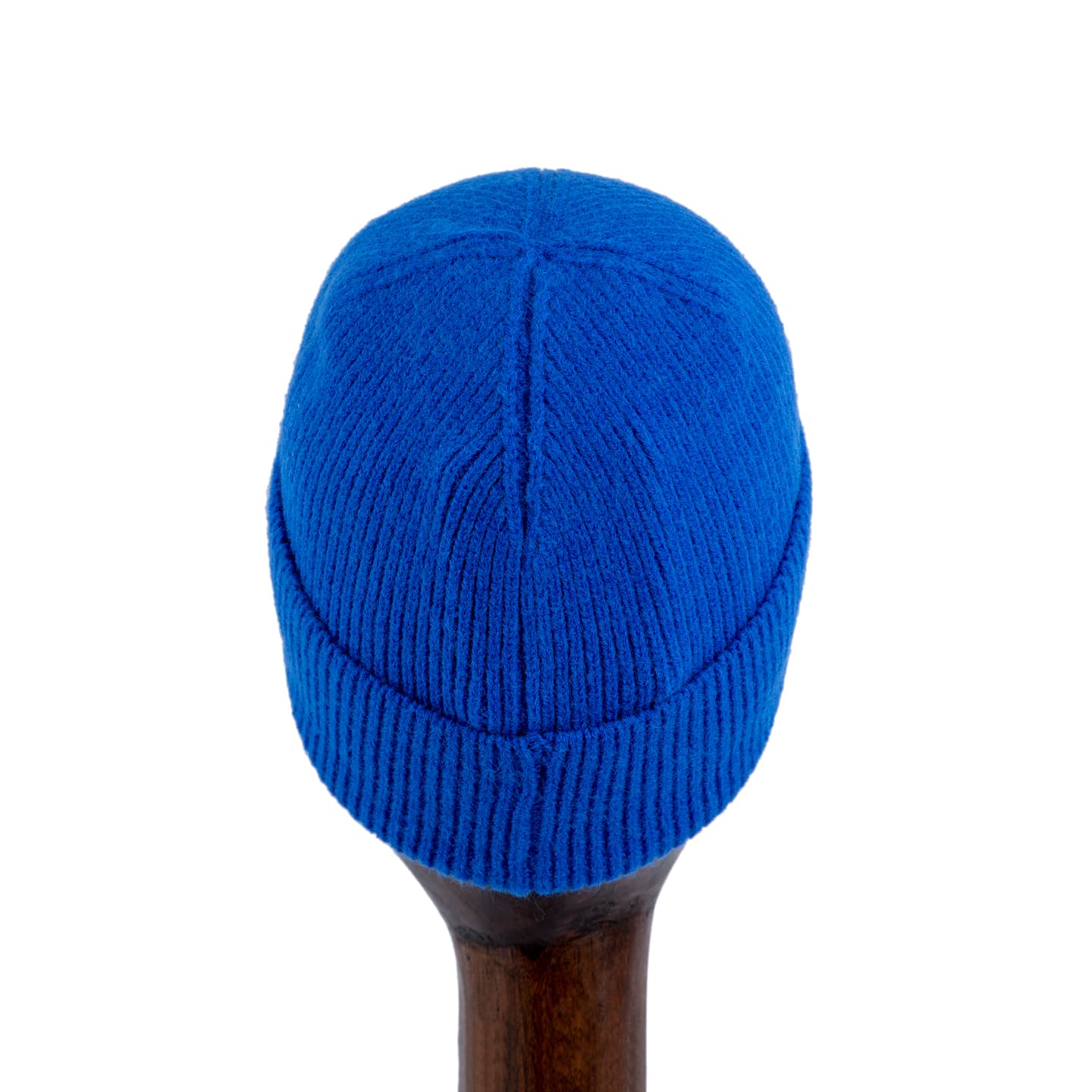 Blue knit beanie with monogram leather patch and gold studs, designed for style and warmth.