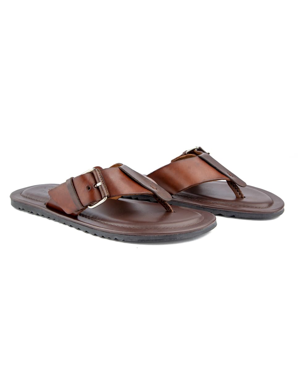 Premium brown leather flip-flop sandals with adjustable buckle straps, cushioned sole, and durable design for comfort and style.