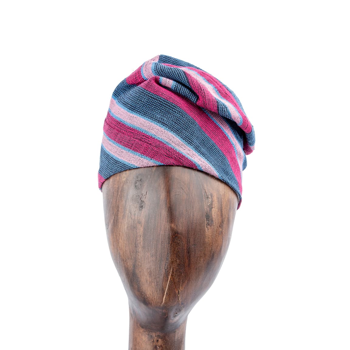 This Unisex Aso-Oke Cap/ Hat  is a stylish and cozy winter accessory featuring a striped pattern in pink, blue, and gray, crafted from a soft cotton knit fabric