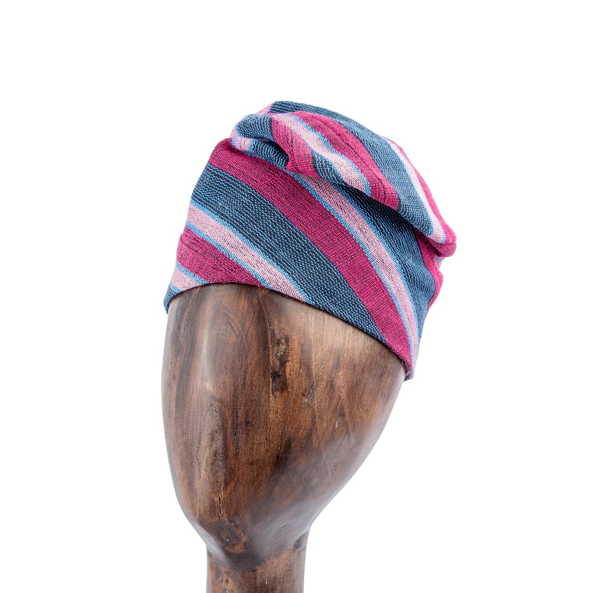 This Unisex Aso-Oke Cap/ Hat  is a stylish and cozy winter accessory featuring a striped pattern in pink, blue, and gray, crafted from a soft cotton knit fabric