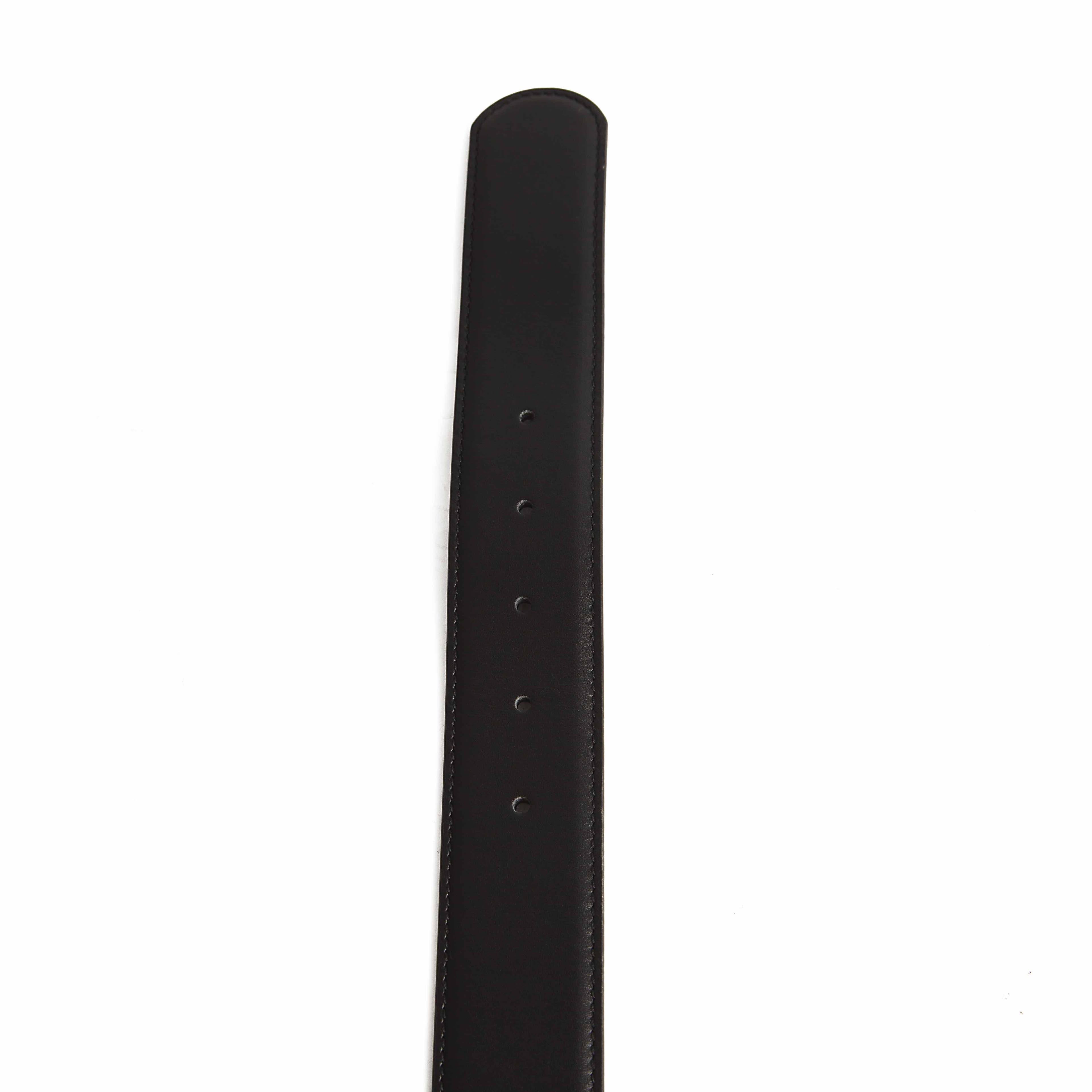 This elegant, slim-profile belt is a masterclass in understated luxury and timeless design.