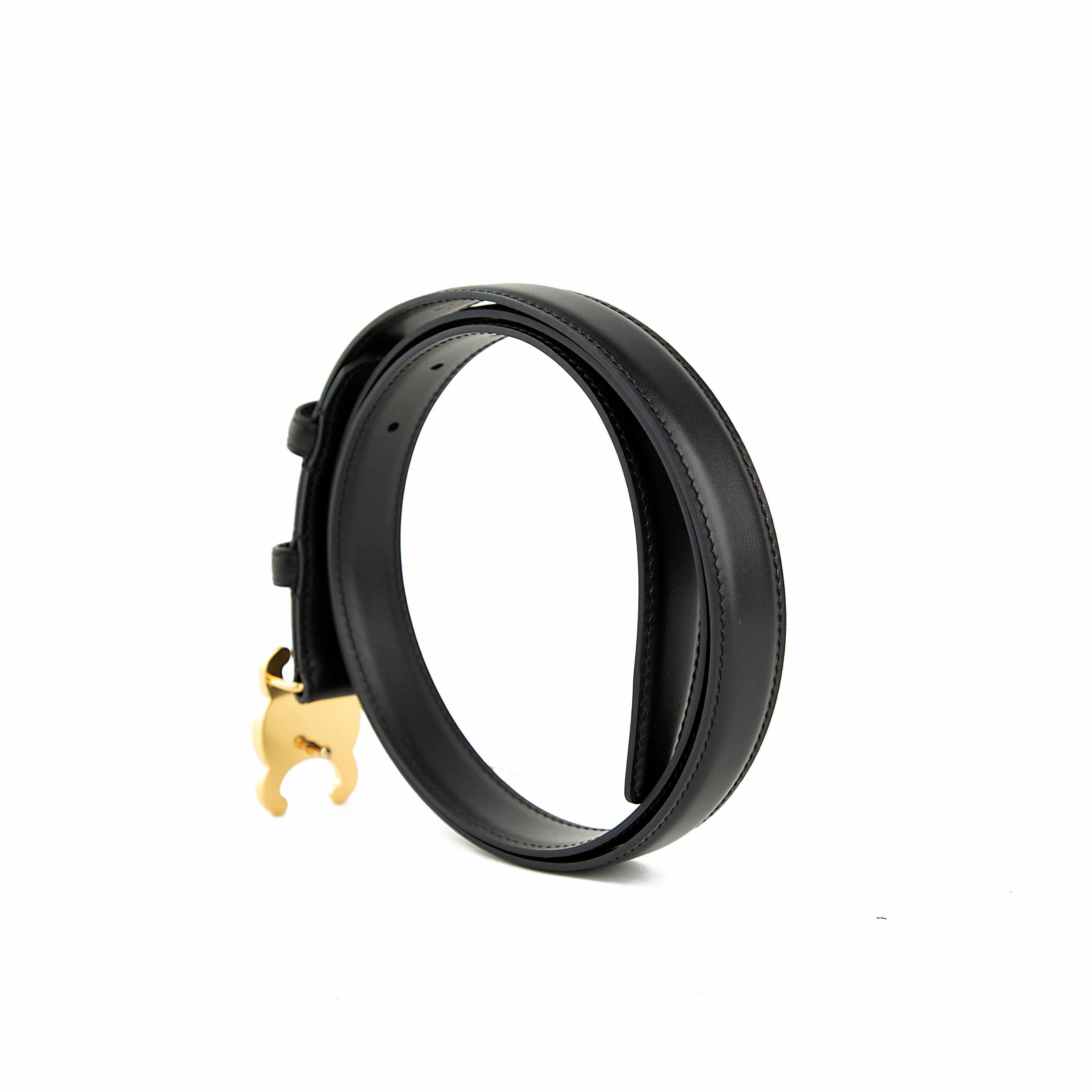 This elegant accessory is a masterclass in understated luxury, featuring a smooth, semi-matte black calfskin leather strap.