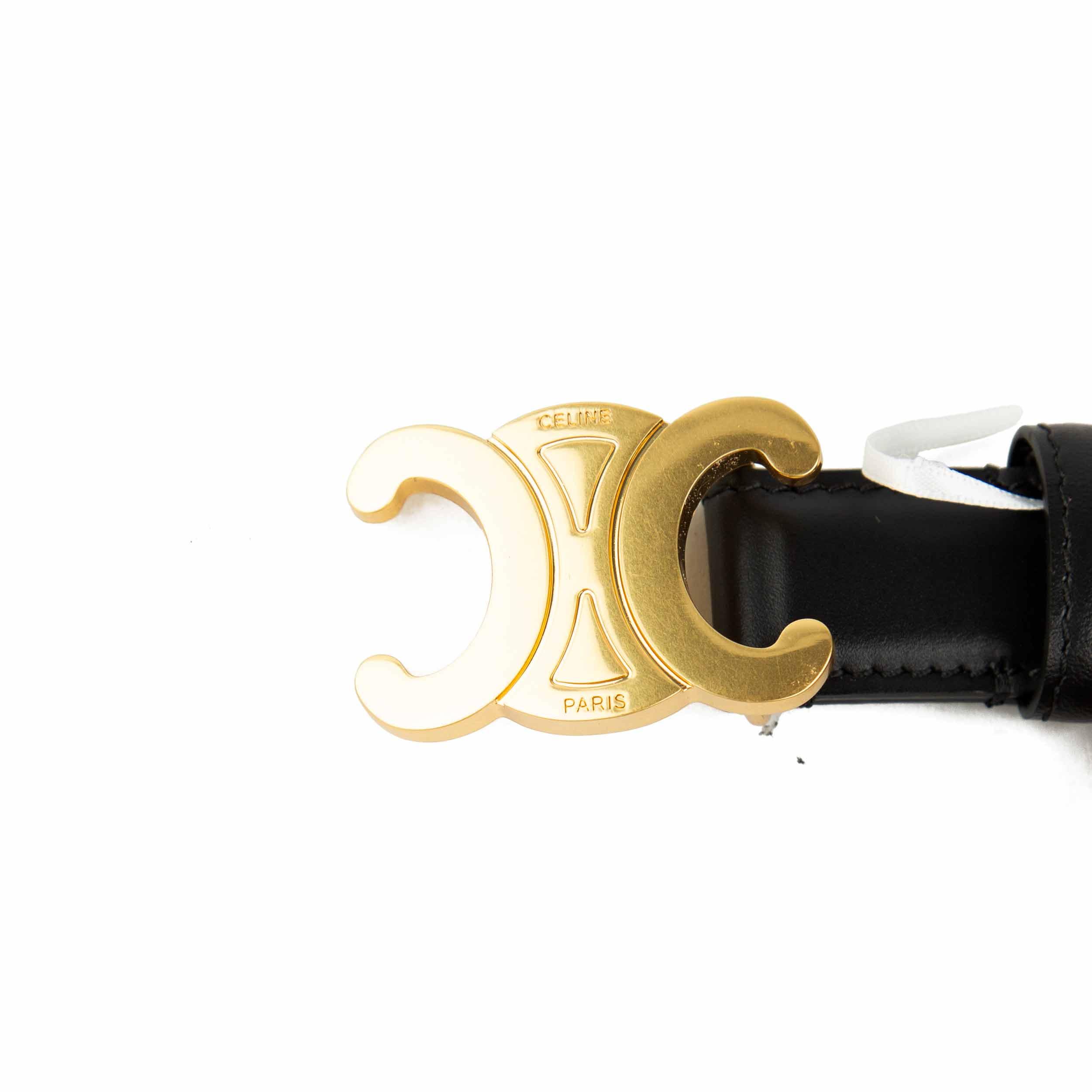 This elegant accessory is a masterclass in understated luxury, featuring a smooth, semi-matte black calfskin leather strap.