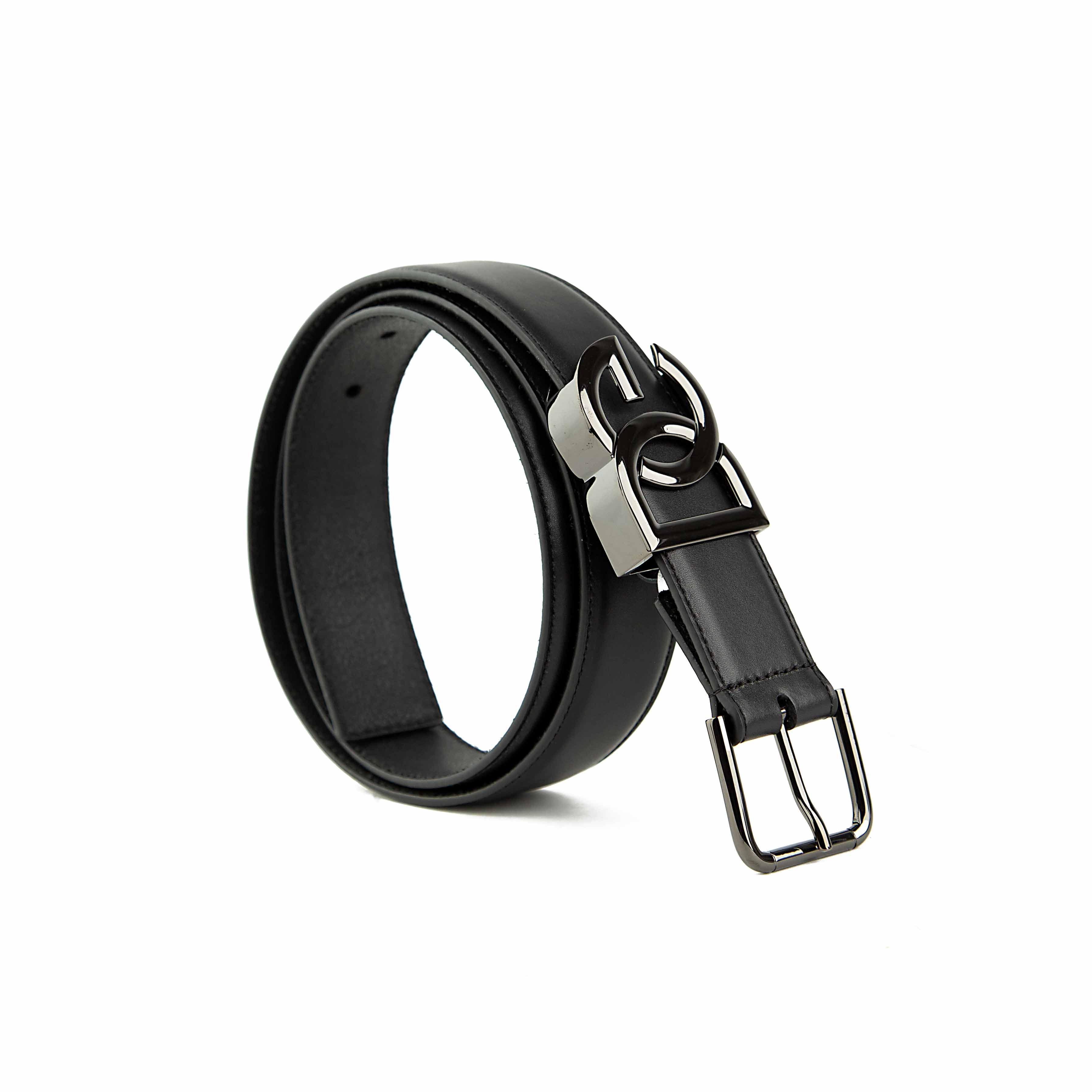 This sophisticated belt offers a unique twist on classic design with its distinctive dual-buckle system.