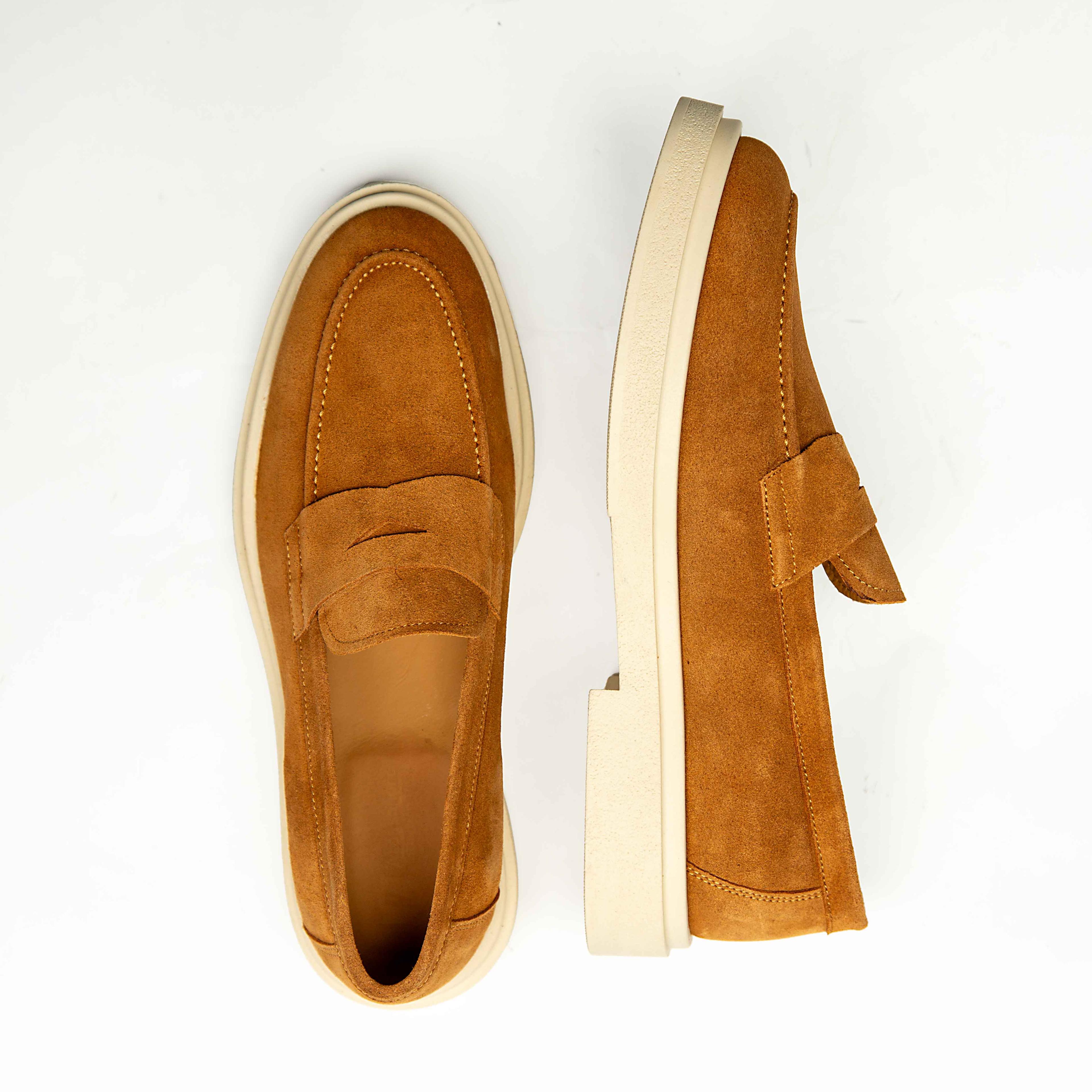 Agu & Sons Ltd tobacco tan suede penny loafers with thick cream-colored chunky rubber soles on a white background.