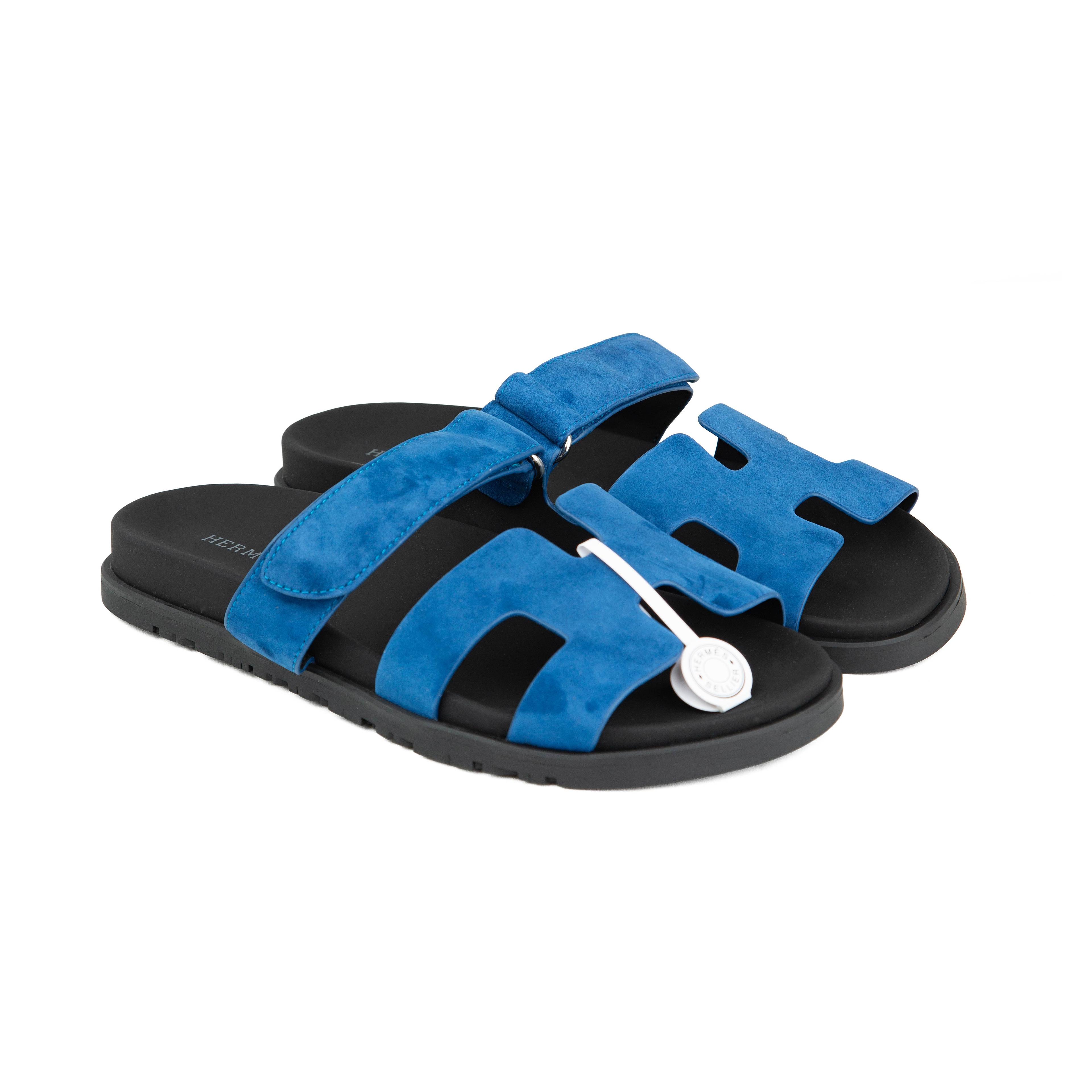 Discover the Hermès Chypre sandals in Electric Blue suede.