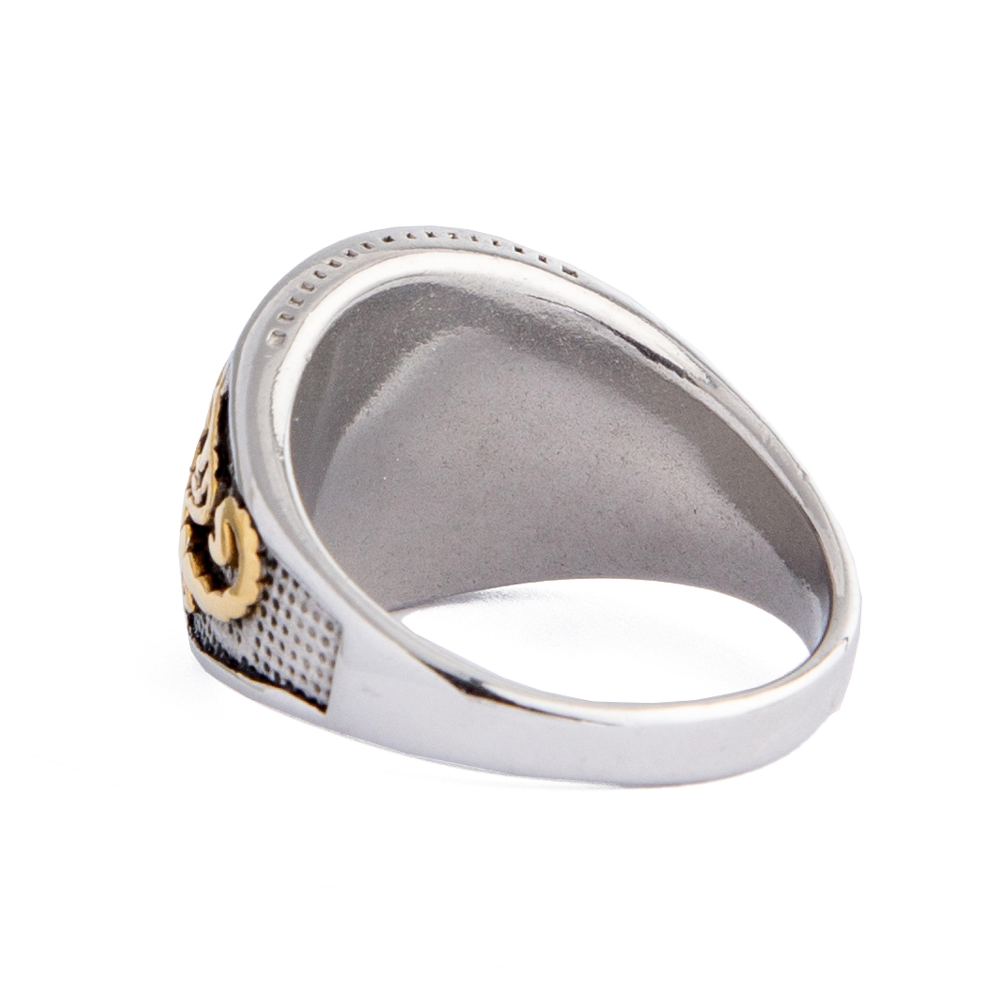 Silver and gold statement ring featuring a scorpion design with black stone accents.