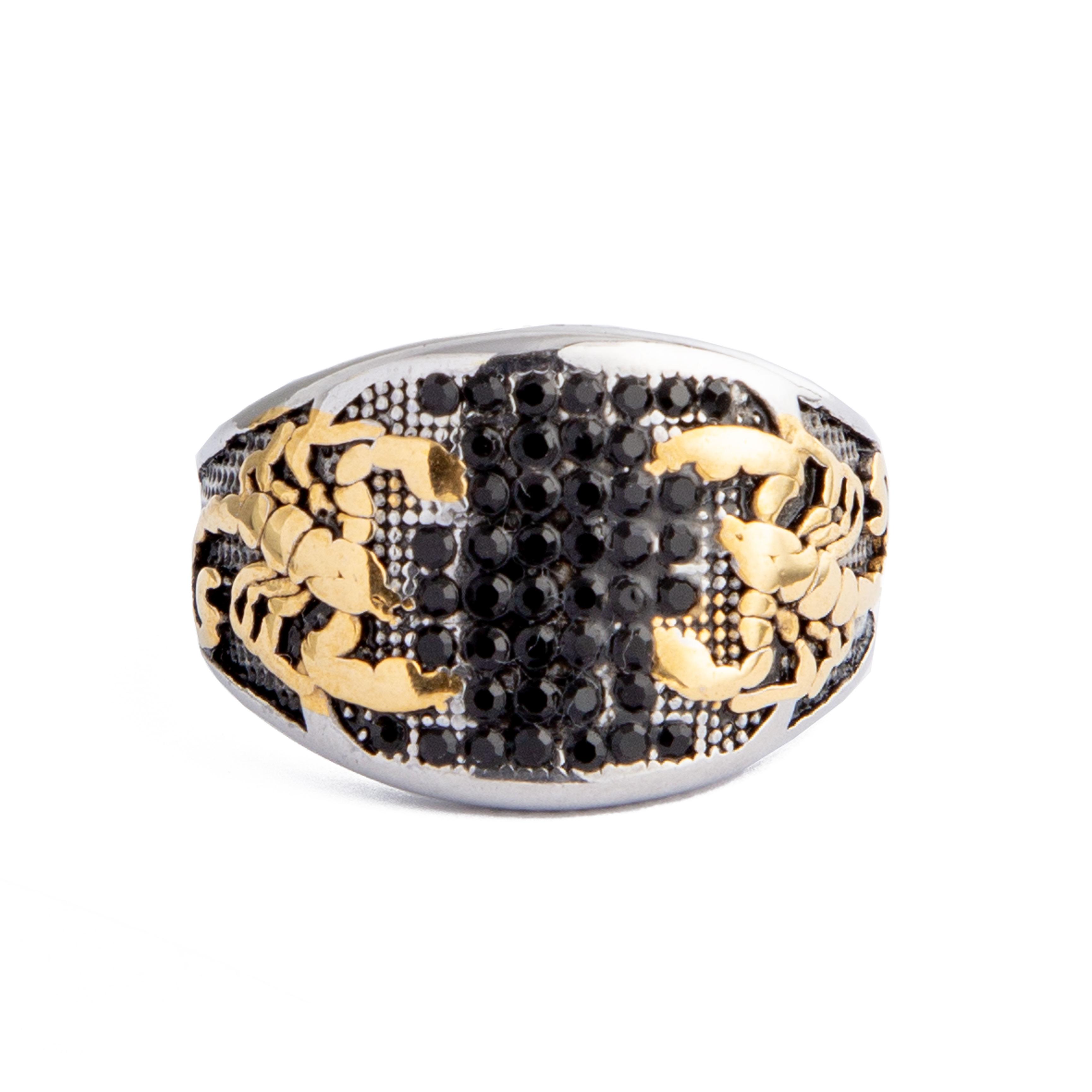 Silver and gold statement ring featuring a scorpion design with black stone accents.