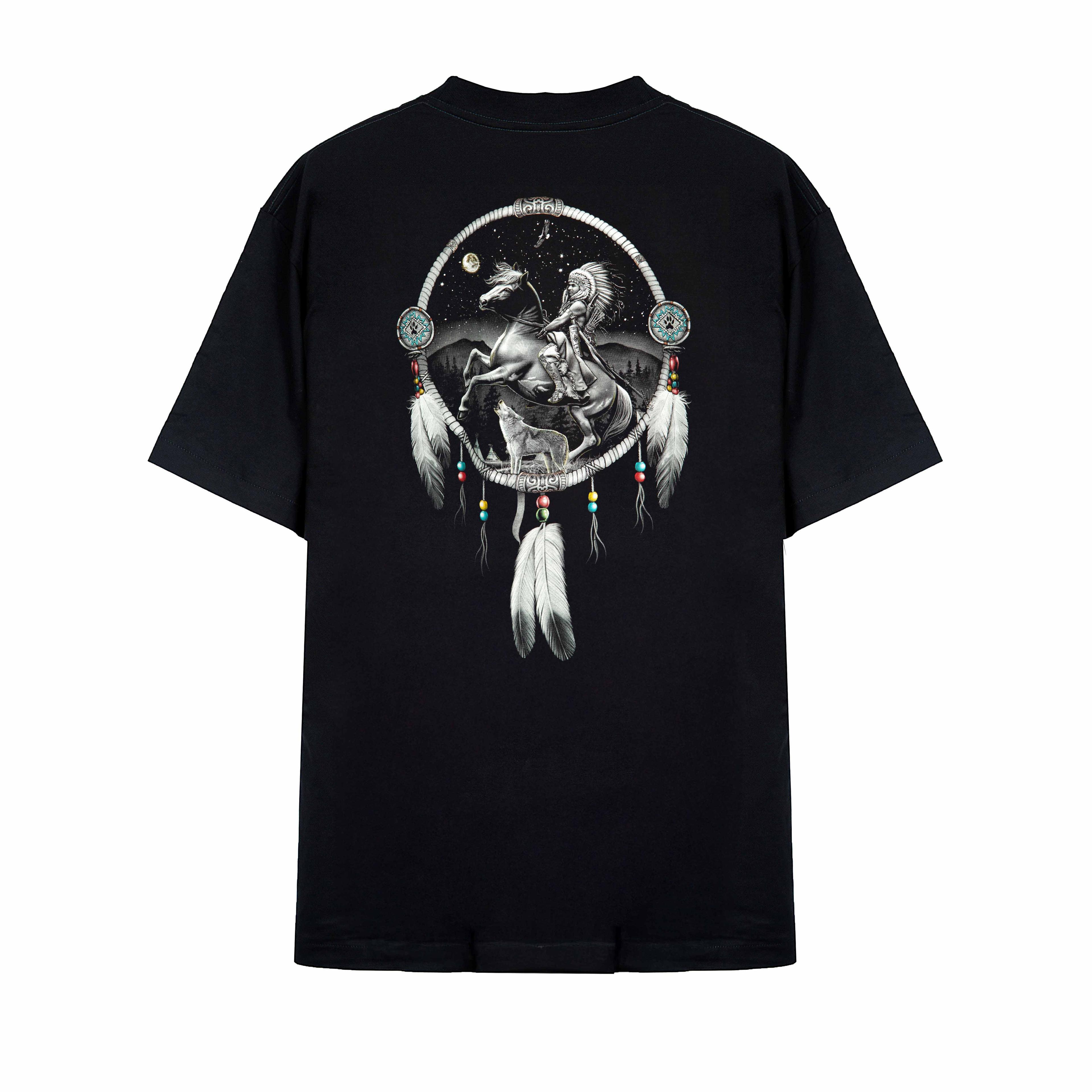 Rock Eagle black unisex t-shirt with a detailed graphic of a Native American Chief in a feather bonnet kneeling by a campfire near a teepee under a star-lit night sky.