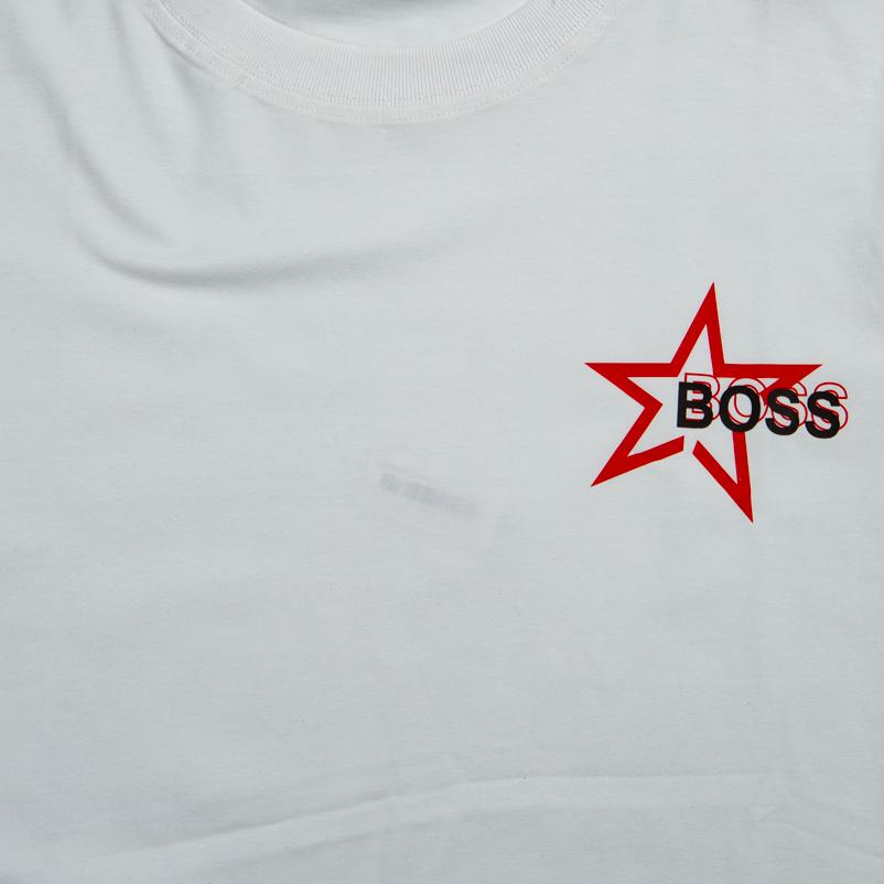 A clean, classic white, short-sleeved, crew-neck t-shirt. It features a small, striking graphic positioned on the left chest area