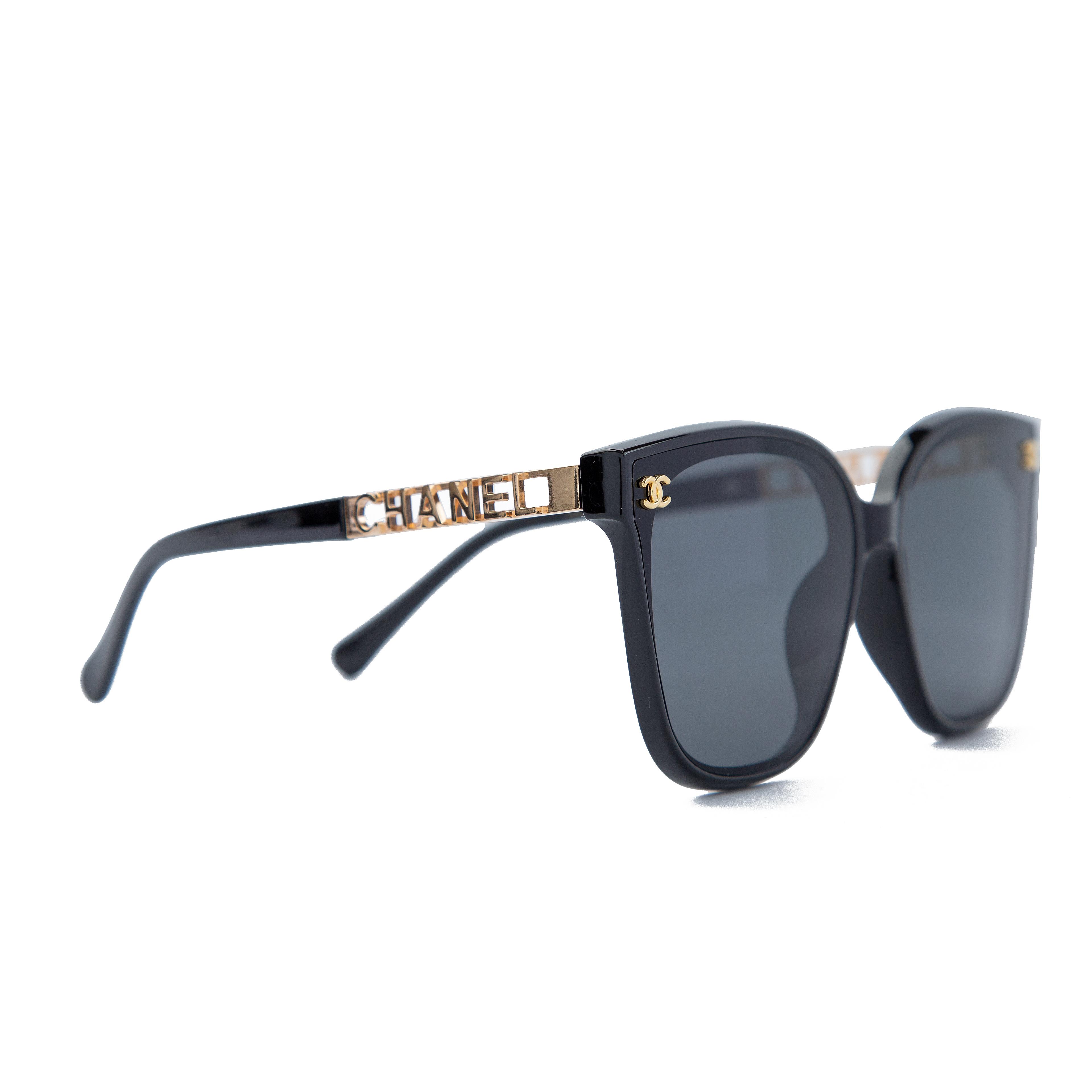 Chanel black cat-eye sunglasses with gold side detailing, luxury UV-protective eyewear featuring a stylish and elegant design