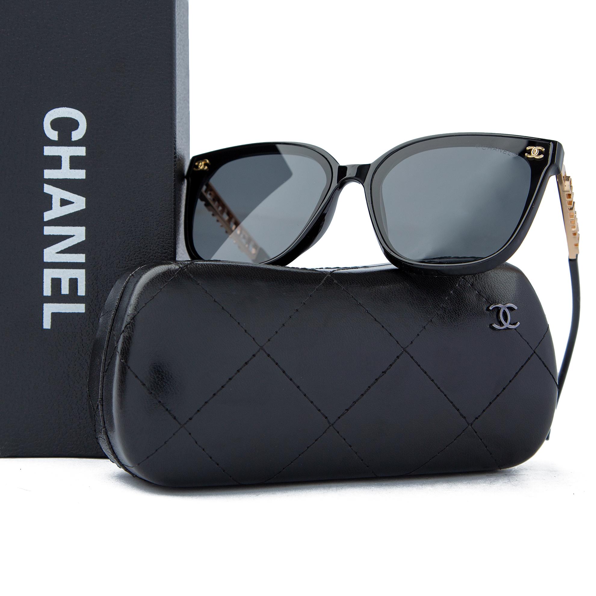 Chanel black cat-eye sunglasses with gold side detailing, luxury UV-protective eyewear featuring a stylish and elegant design