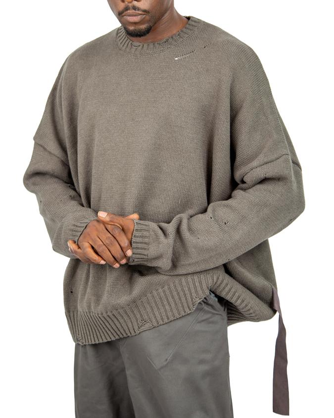  Distressed brown knit sweater with ribbed cuffs and hem.