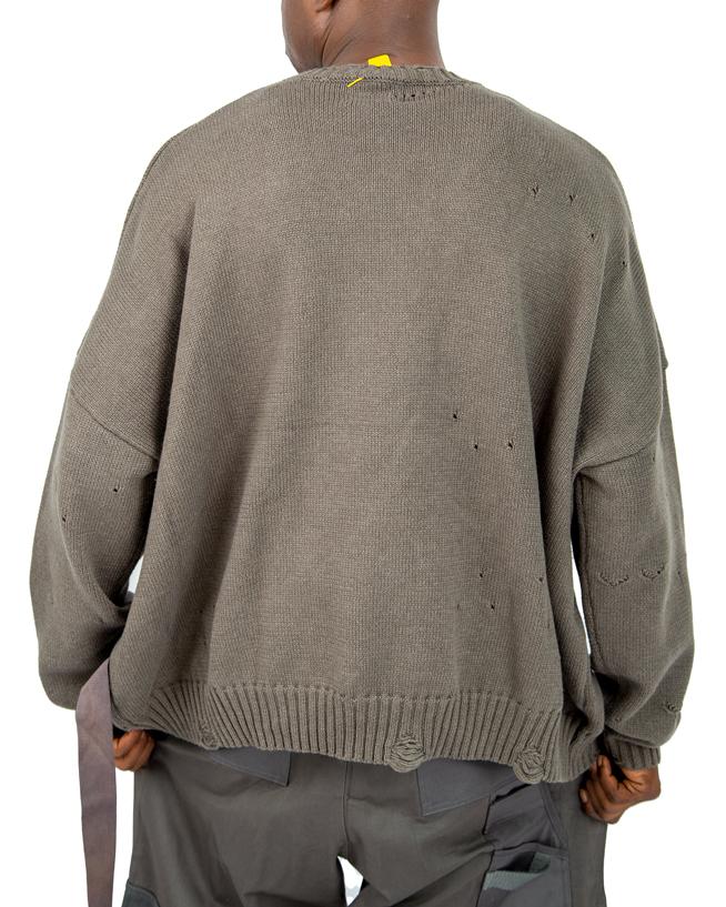  Distressed brown knit sweater with ribbed cuffs and hem.