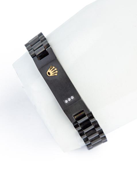 Black watch band style bracelet with crown detail.