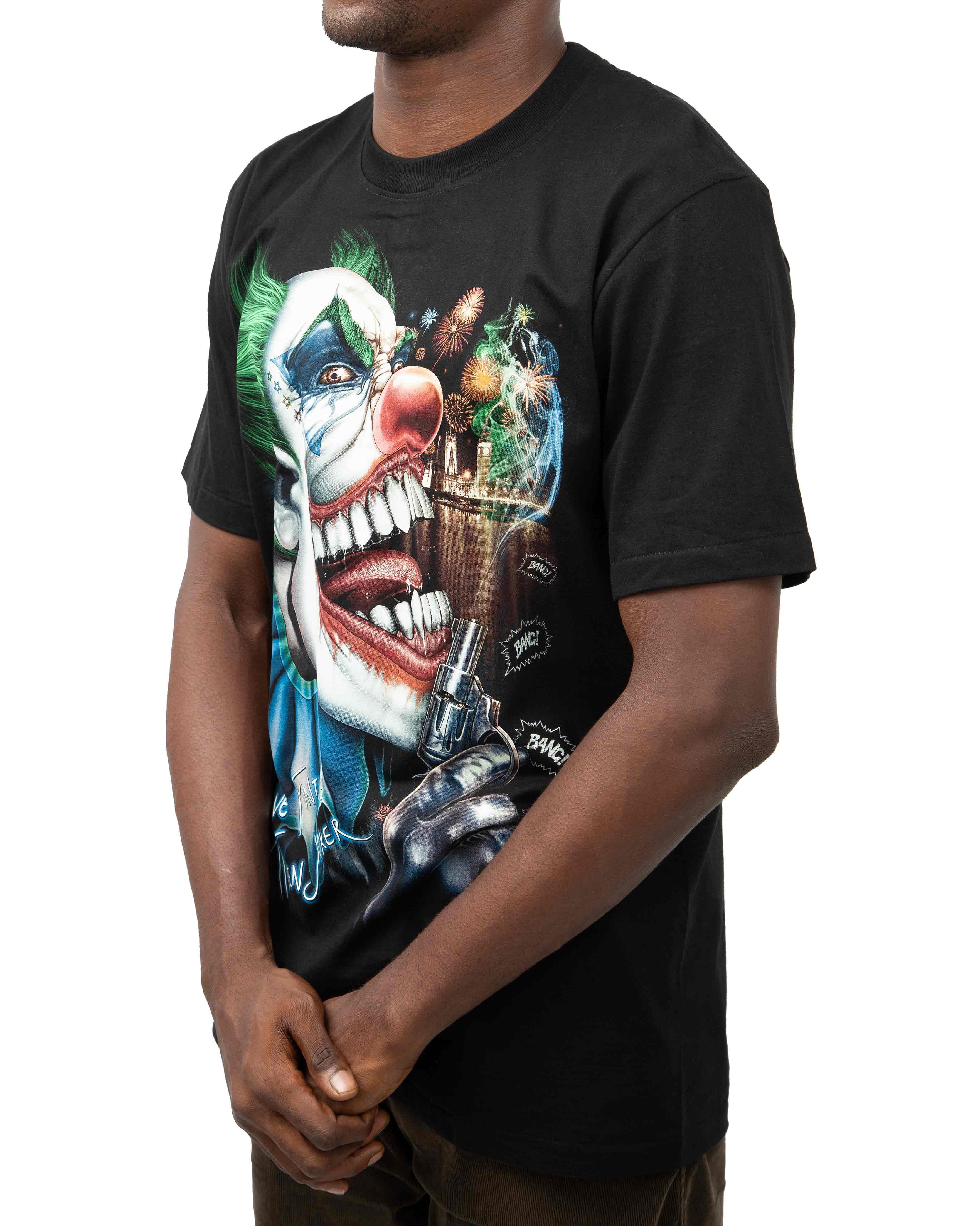 Joker Have Fun Time Graphic T-Shirt - Close-up of the Joker with a pistol and cityscape background