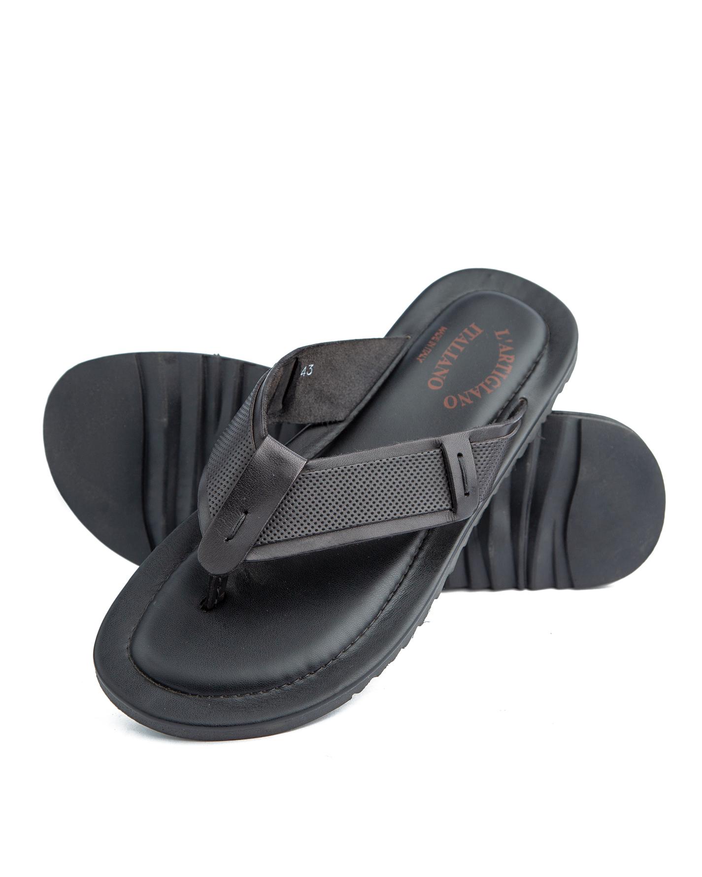 Black leather cross-strap sandals. 