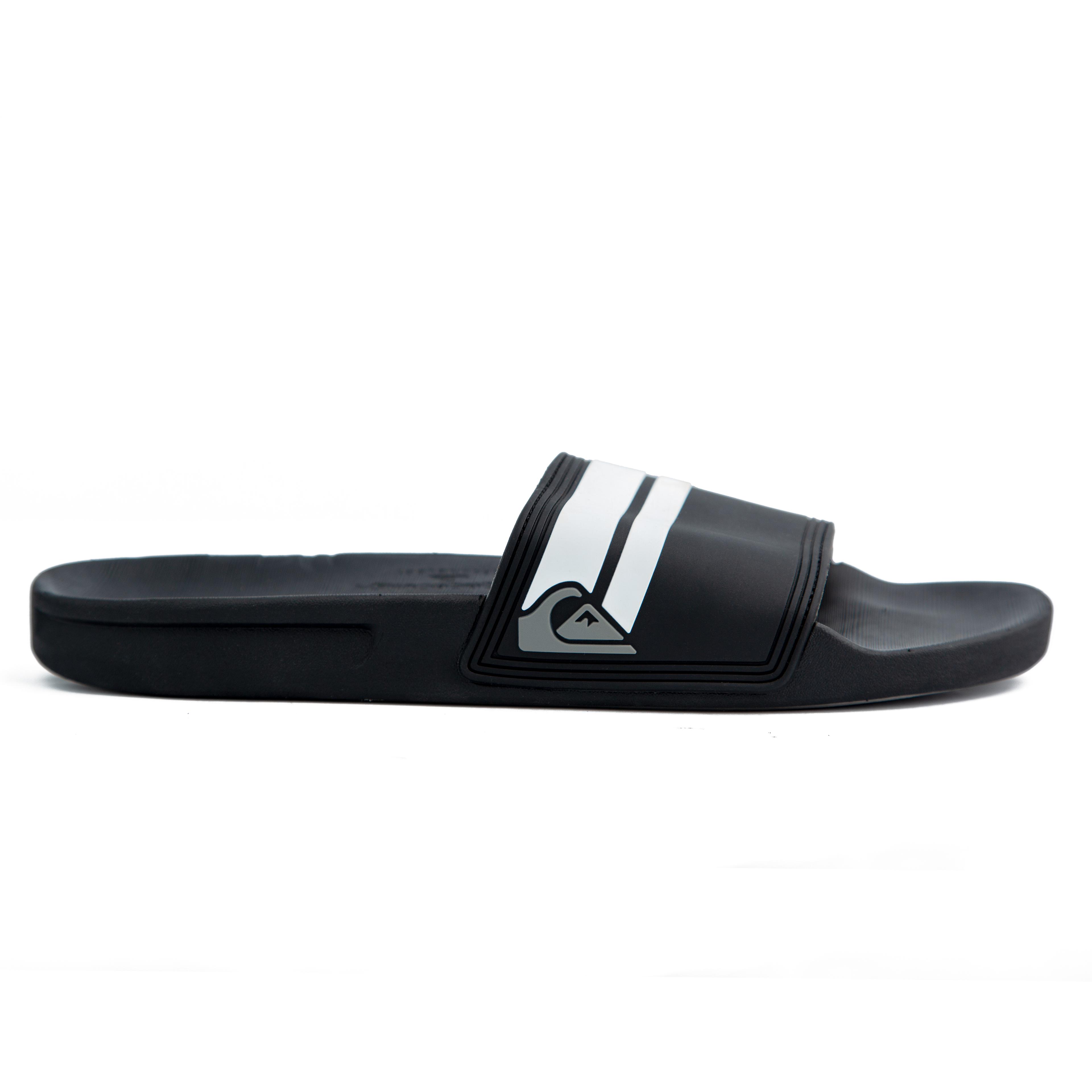 Black Adidas Adilette Comfort Slides with white stripes – stylish, lightweight, and cushioned for ultimate comfort. Perfect for casual and sporty looks.