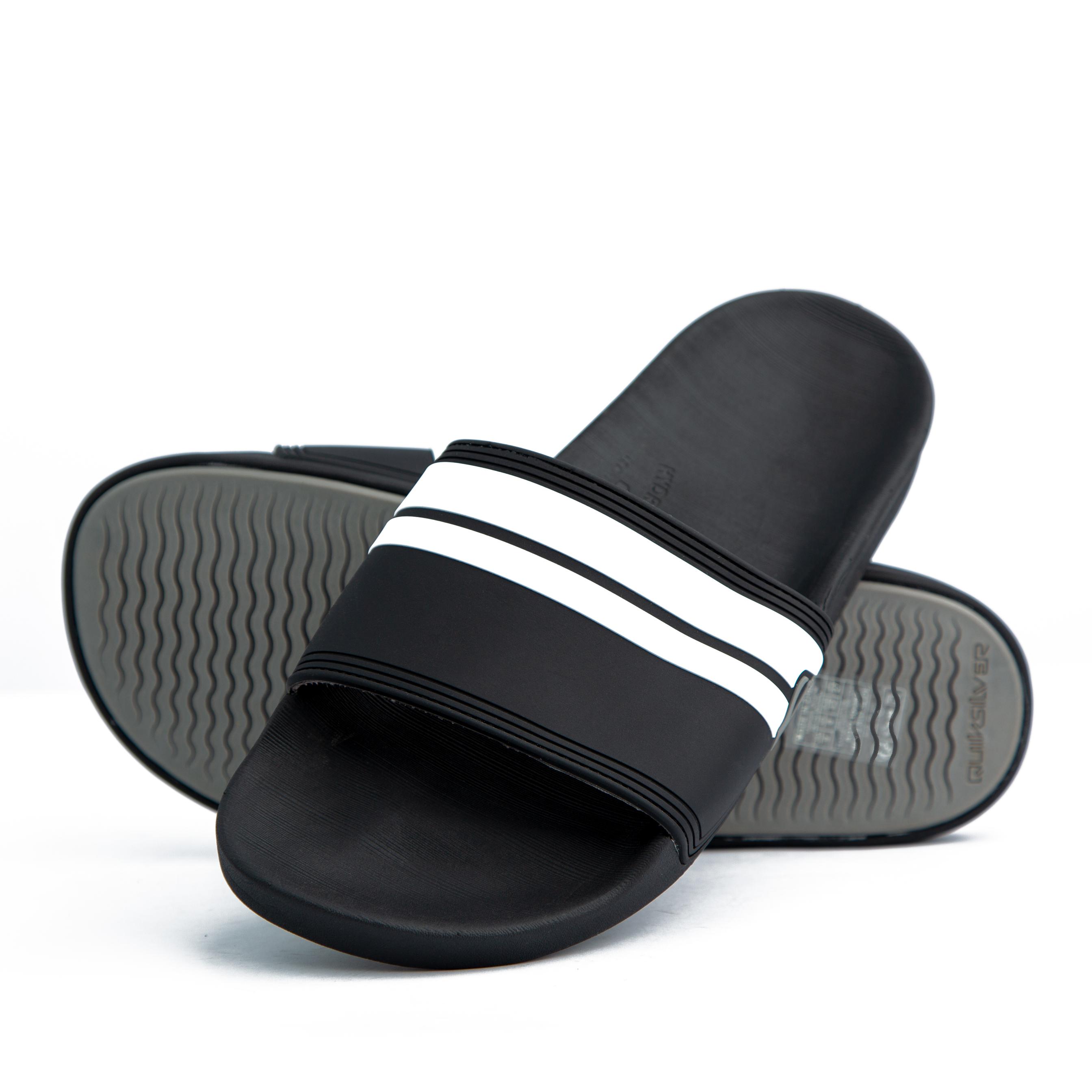 Black Adidas Adilette Comfort Slides with white stripes – stylish, lightweight, and cushioned for ultimate comfort. Perfect for casual and sporty looks.