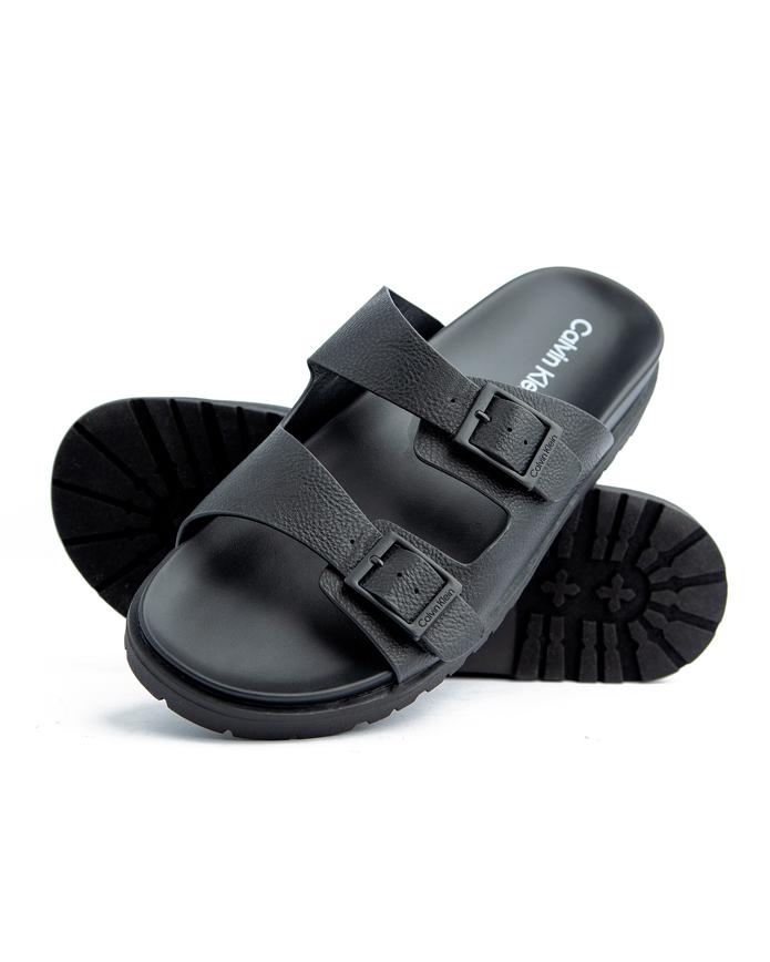 Upgrade your footwear collection with Calvin Klein Black Double Strap Sandals. Designed for comfort and style, these durable sandals offer a perfect fit for every step.