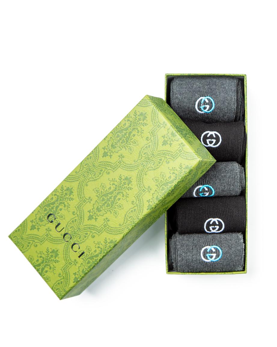 Gucci Cotton Blend Socks Multi-Pack, featuring grey, black, and dark grey heather pairs with ribbed design and subtle logo detailing.