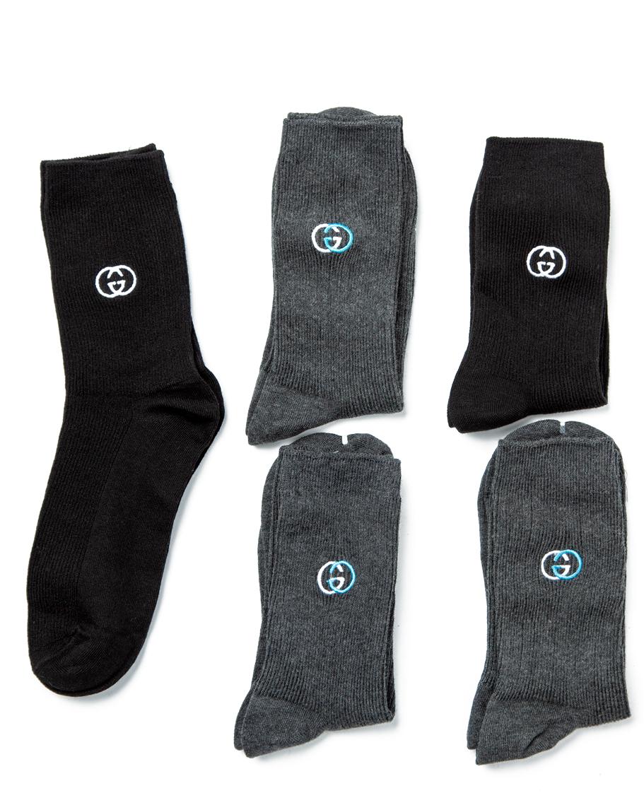 Gucci Cotton Blend Socks Multi-Pack, featuring grey, black, and dark grey heather pairs with ribbed design and subtle logo detailing.
