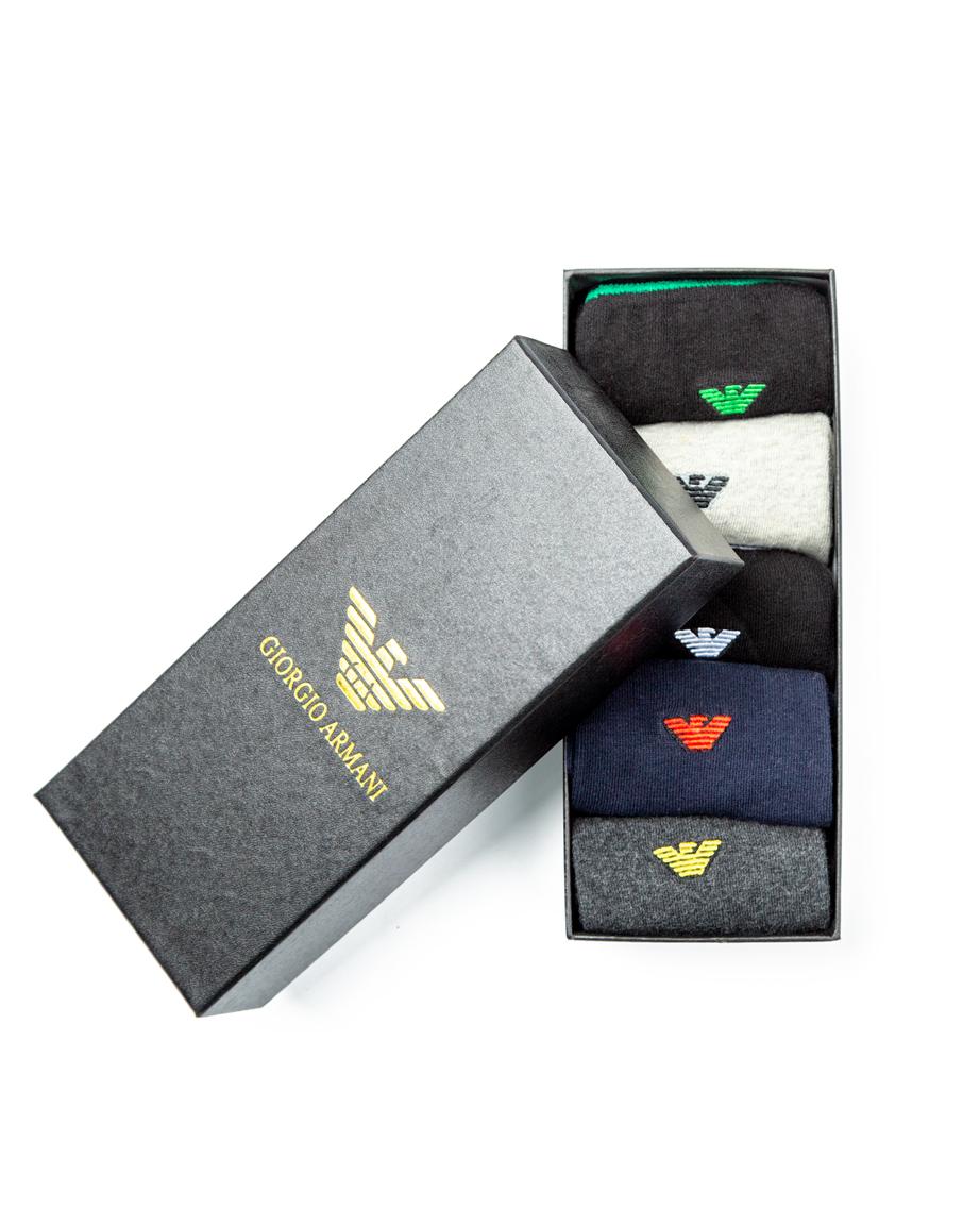 Giorgio Armani Cotton Blend Socks Multi-Pack, featuring black, light grey, navy, and dark grey pairs with ribbed design and signature logo detailing.