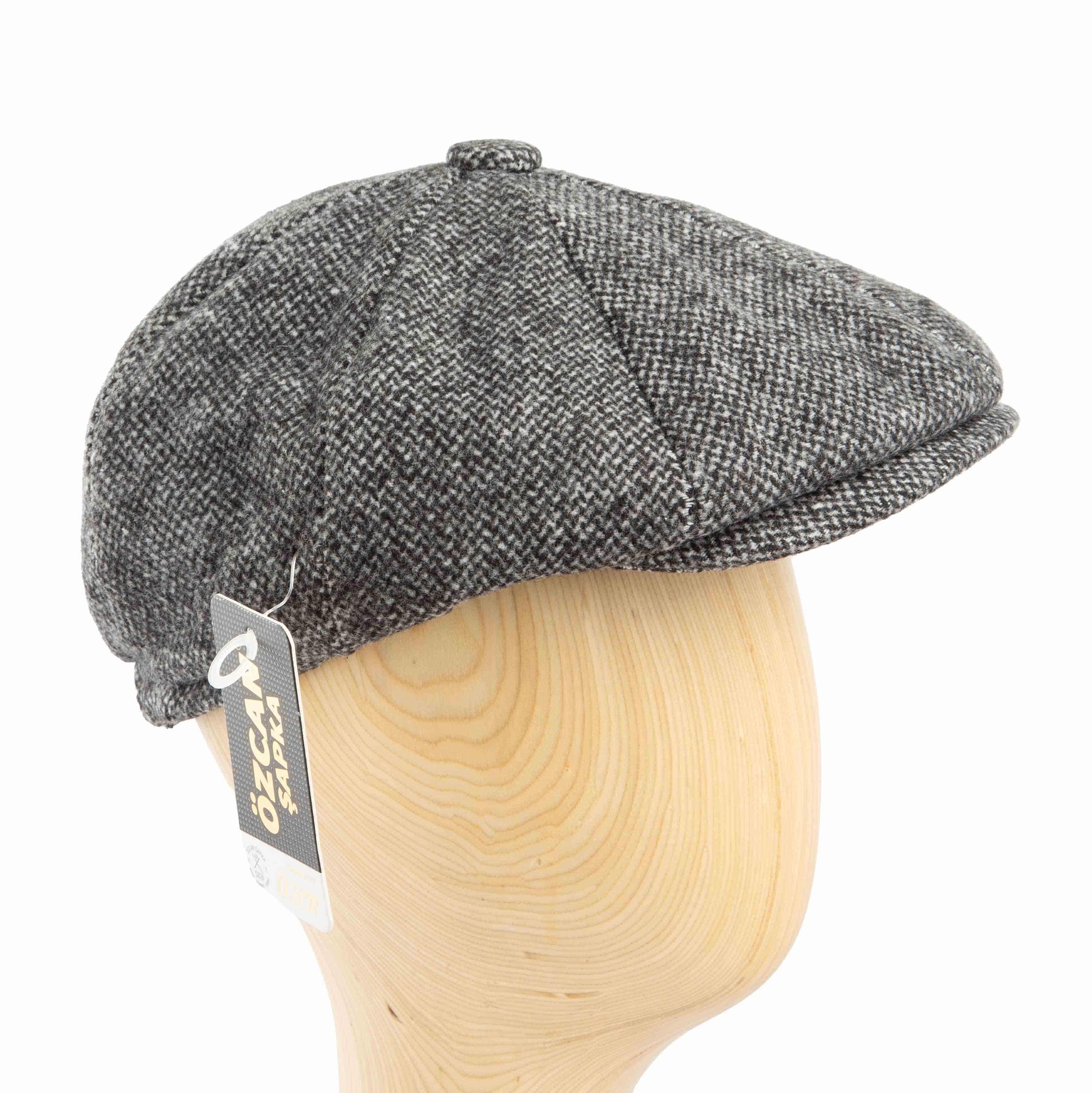 Grey tweed flat cap with a classic design and durable construction, perfect for adding a touch of vintage style to any outfit.