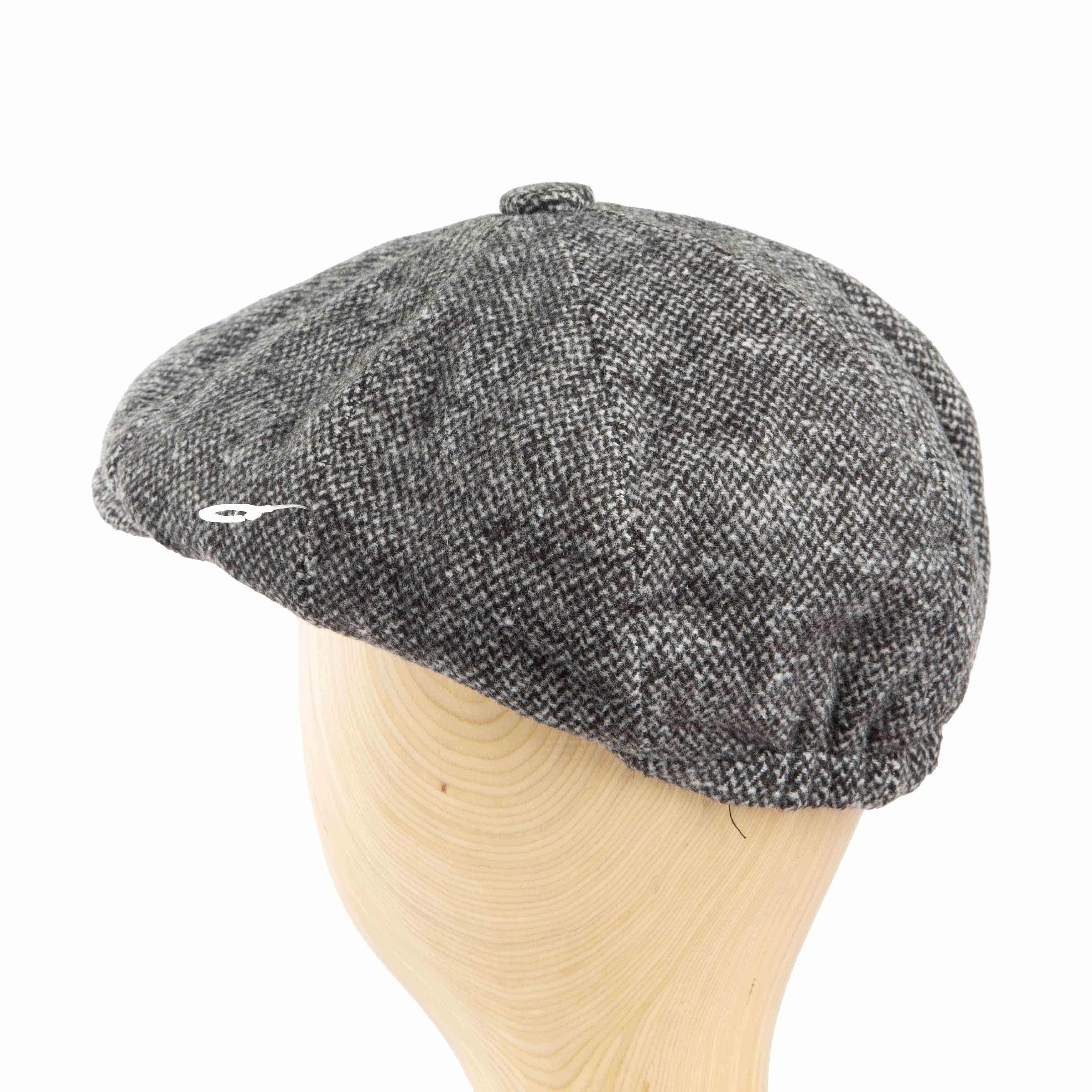 Grey tweed flat cap with a classic design and durable construction, perfect for adding a touch of vintage style to any outfit."