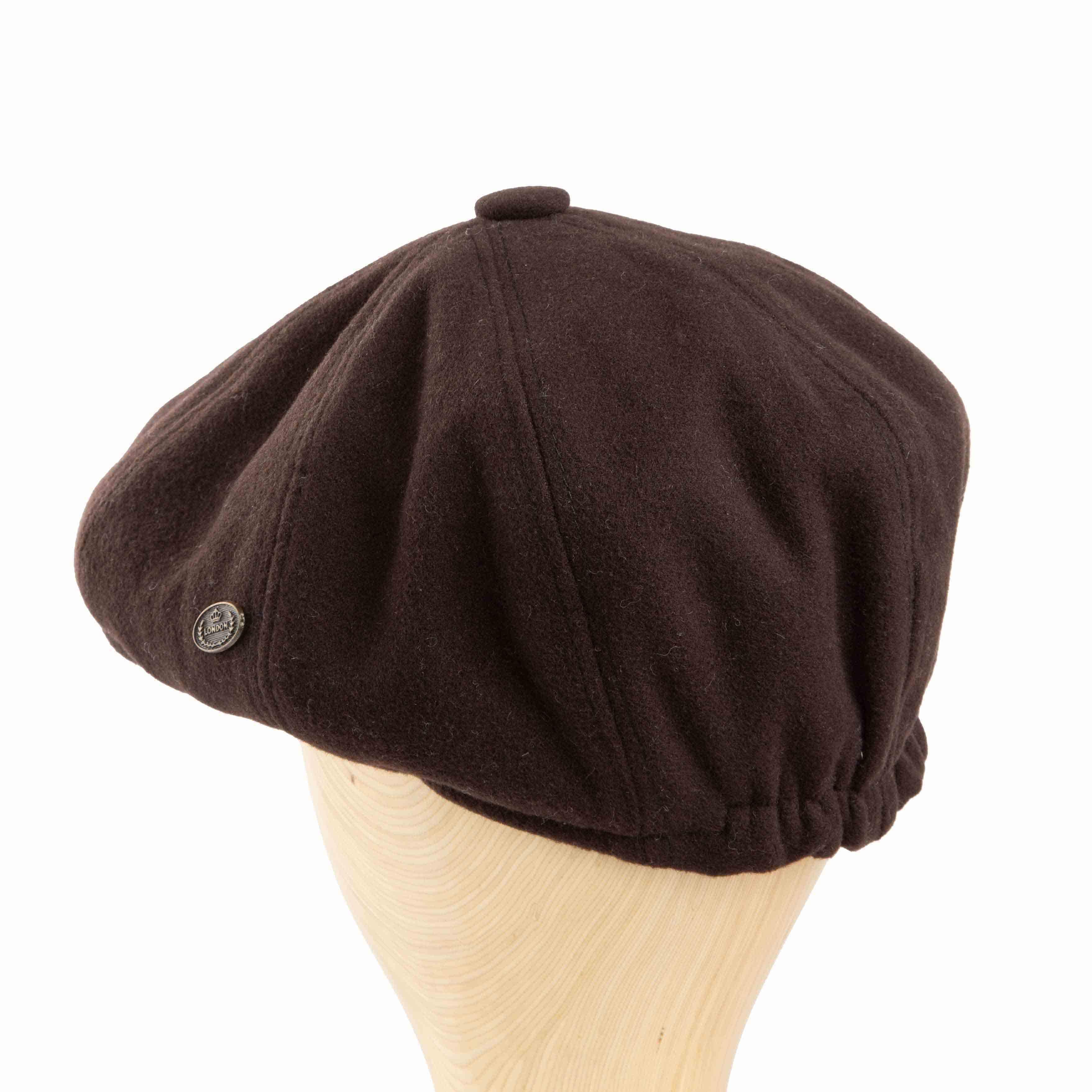 Solid brown newsboy cap with a classic 8-panel design and subtle side embellishment, perfect for vintage and casual outfits.
