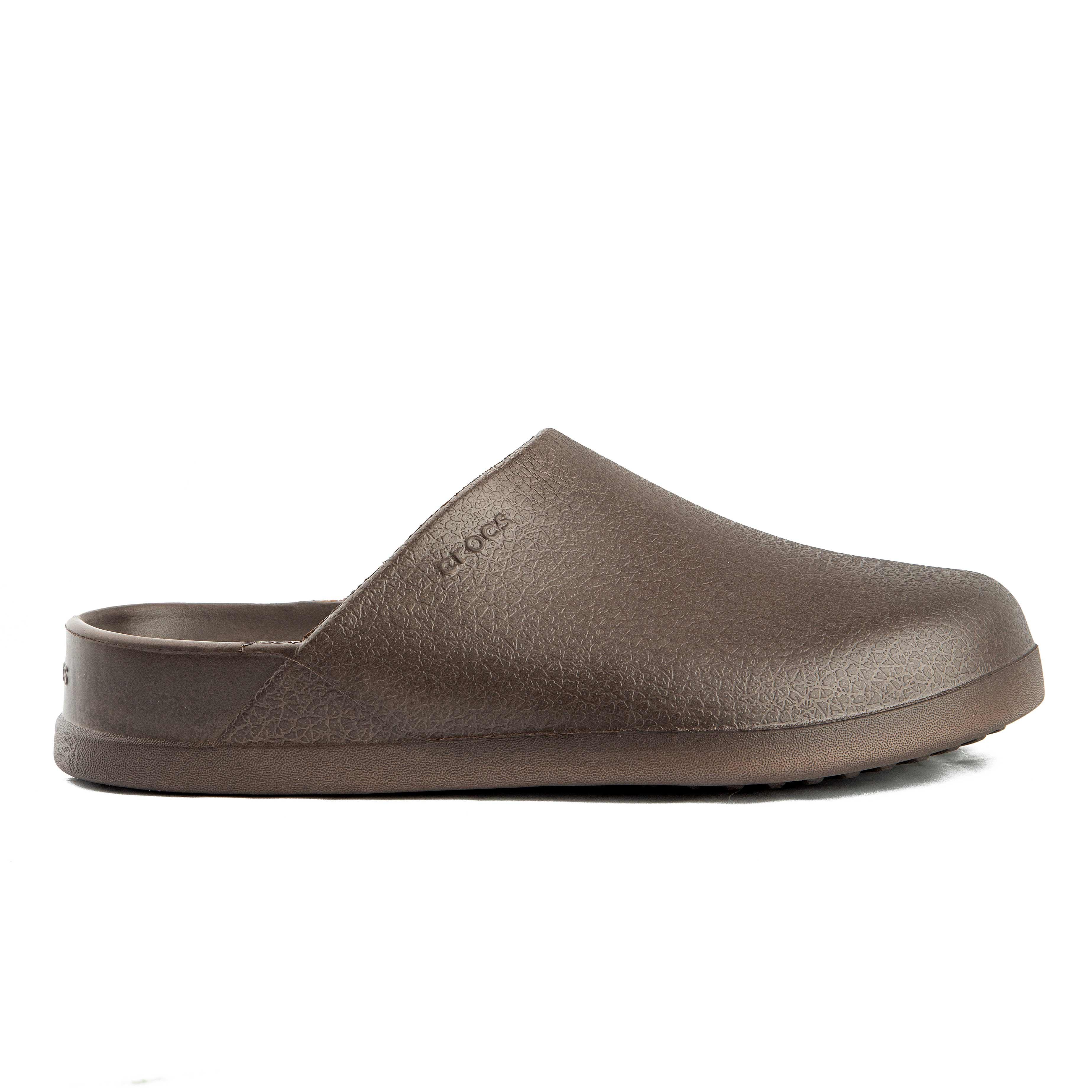This is a pair of closed-toe, unvented clogs in a solid brown color from the Crocs brand.