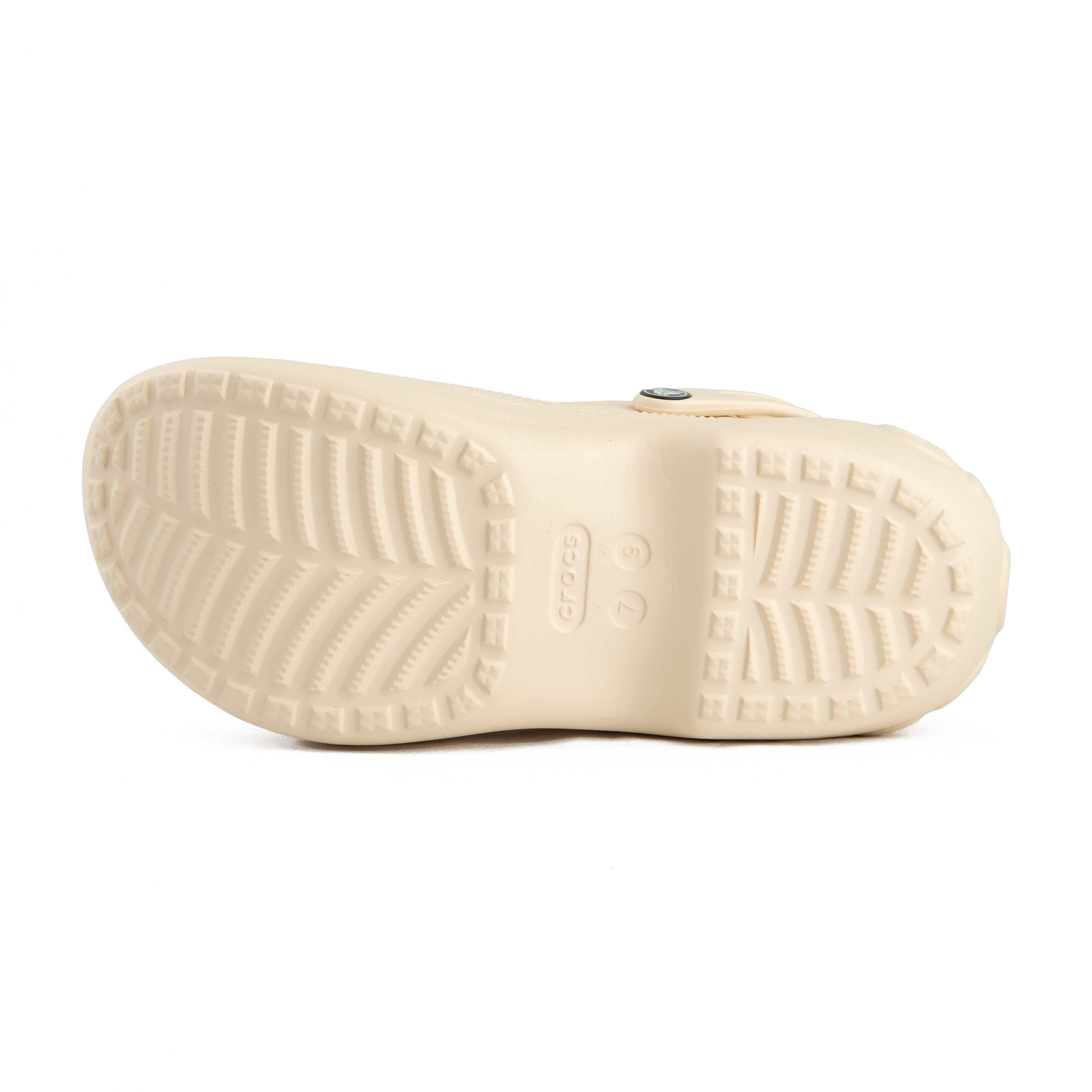 This is a pair of light beige/cream Crocs Classic Platform Clogs