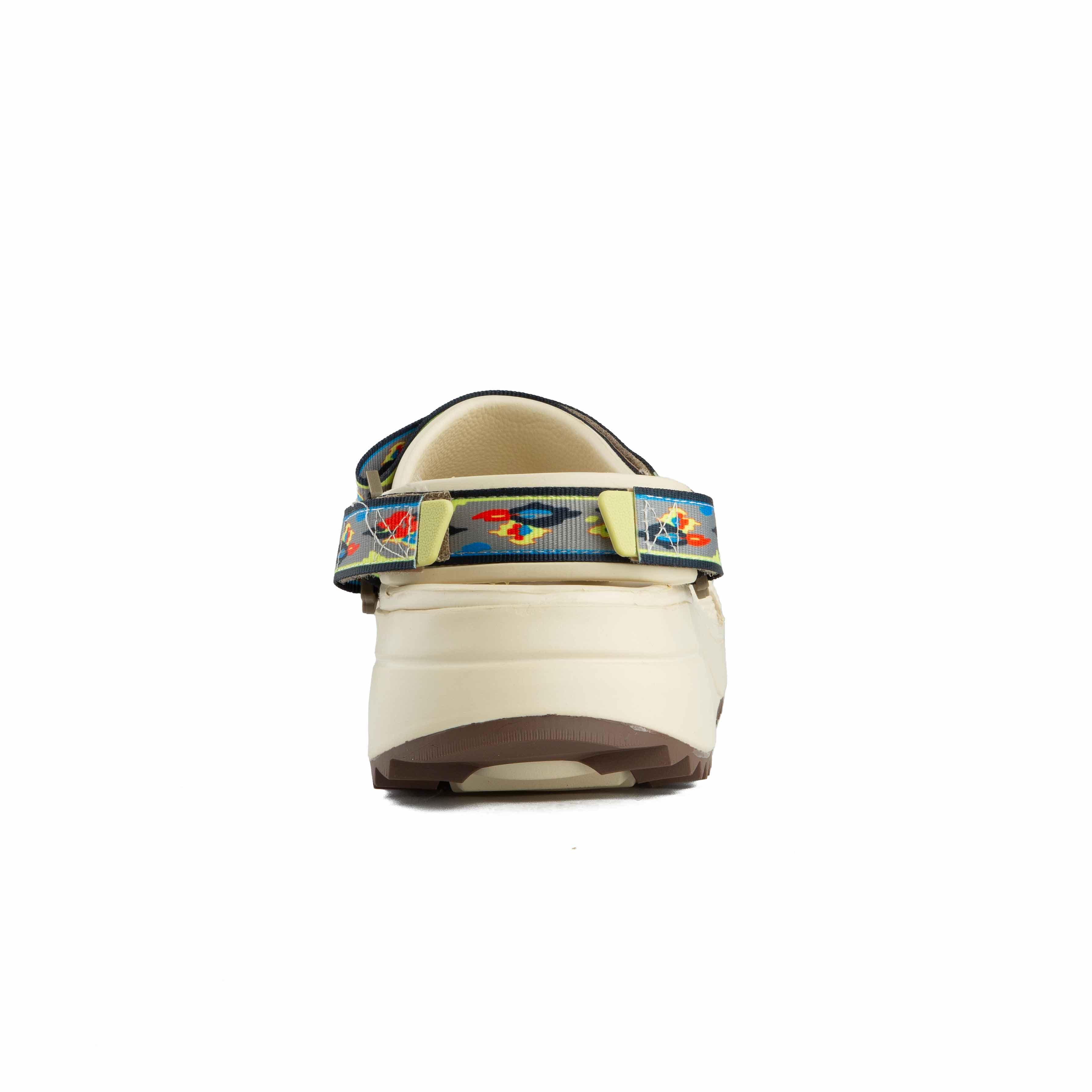Features a unique patterned strap, chunky sole, and custom Jibbitz for ultimate style and comfort.