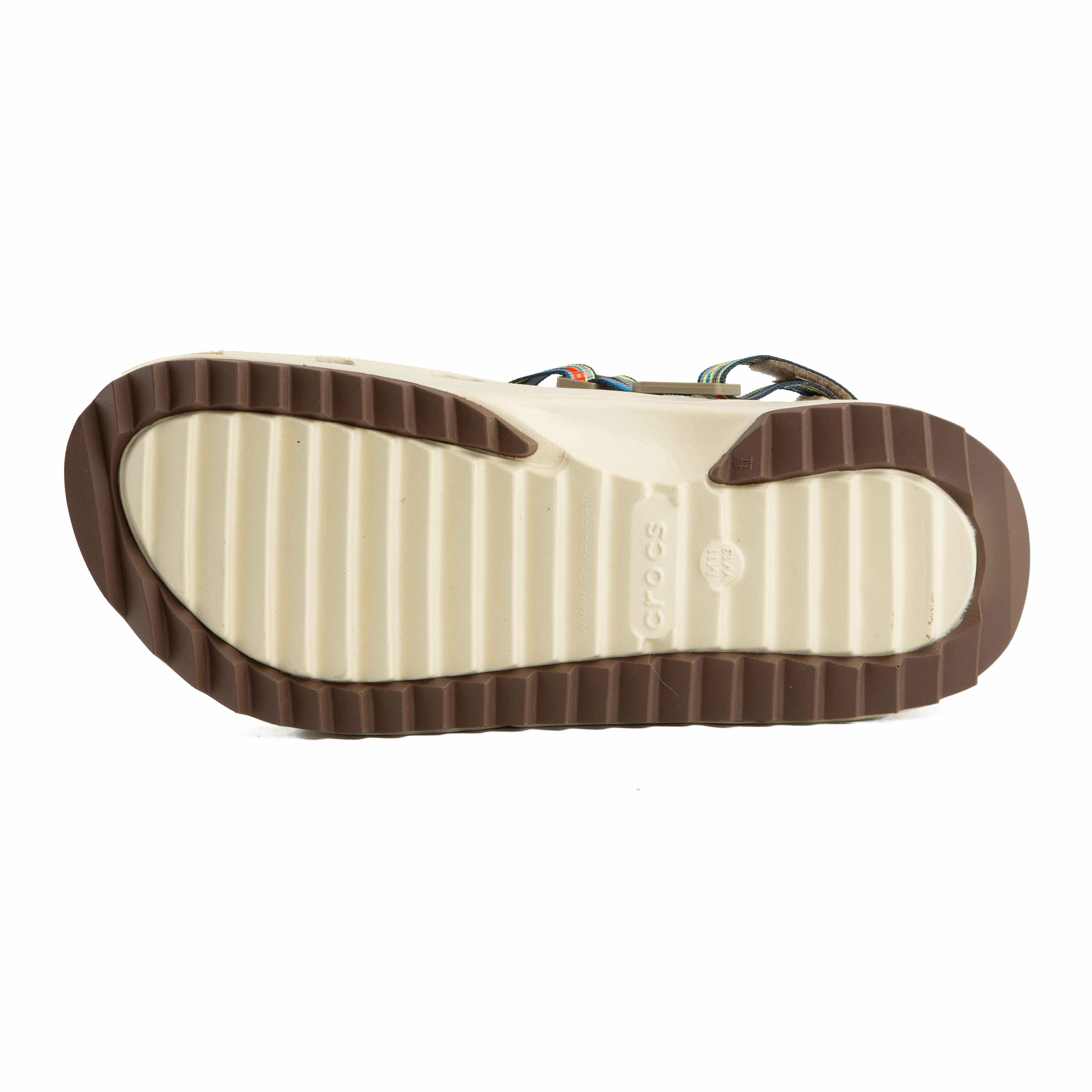 Features a unique patterned strap, chunky sole, and custom Jibbitz for ultimate style and comfort.